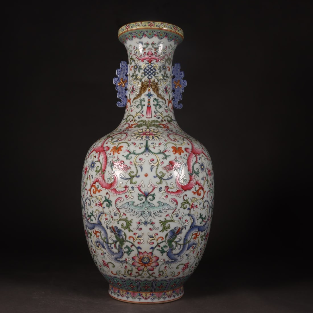An Exquisite Enamel White Ground Lotus and Dragon Pattern Double-Ears Vase: An Exquisite Enamel White Ground Lotus and Dragon Pattern Double-Ears Vase,Qing Dynasty, China,Qianlong Six-character Mark,Size:15.2inx3.7inx7.1inx4.3in 珐琅彩白地缠