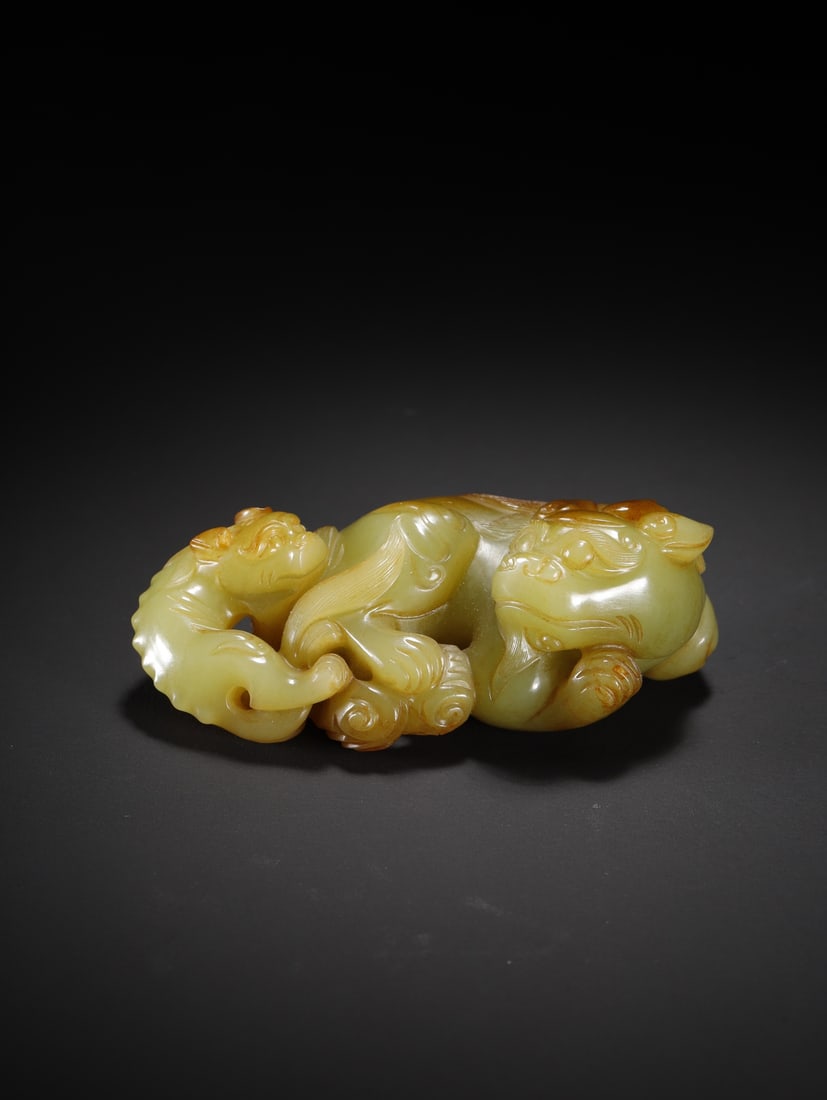 An Exquisite Hotan Yellow Jade Lion Ornament: An Exquisite Hotan Yellow Jade Lion Ornament,Qing Dynasty, China,Size:3.3inx1.9inx1.2in,Weight:145.5g 和田黄玉狮子摆件,中国清代