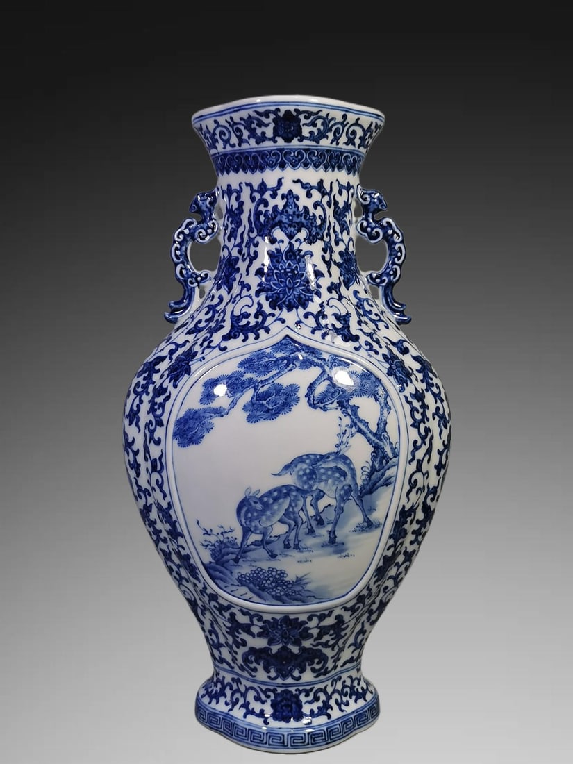 An Exquisite Blue and White Pine and Deer Pattern Double-Ears Vase: An Exquisite Blue and White Pine and Deer Pattern Double-Ears Vase,Qing Dynasty, China,Qianlong Six-character Mark,Size:15.4inx4.7inx8.1in 青花松鹿纹双耳ī