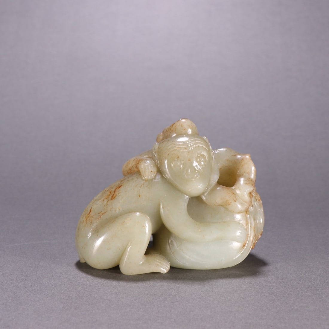 An Exquisite Hotan Jade Monkey Ornament: An Exquisite Hotan Jade Monkey Ornament, Qing Dynasty, China,Size:2.6inx3.4in ,Weight:358g 和田玉猴摆件, 中国清代