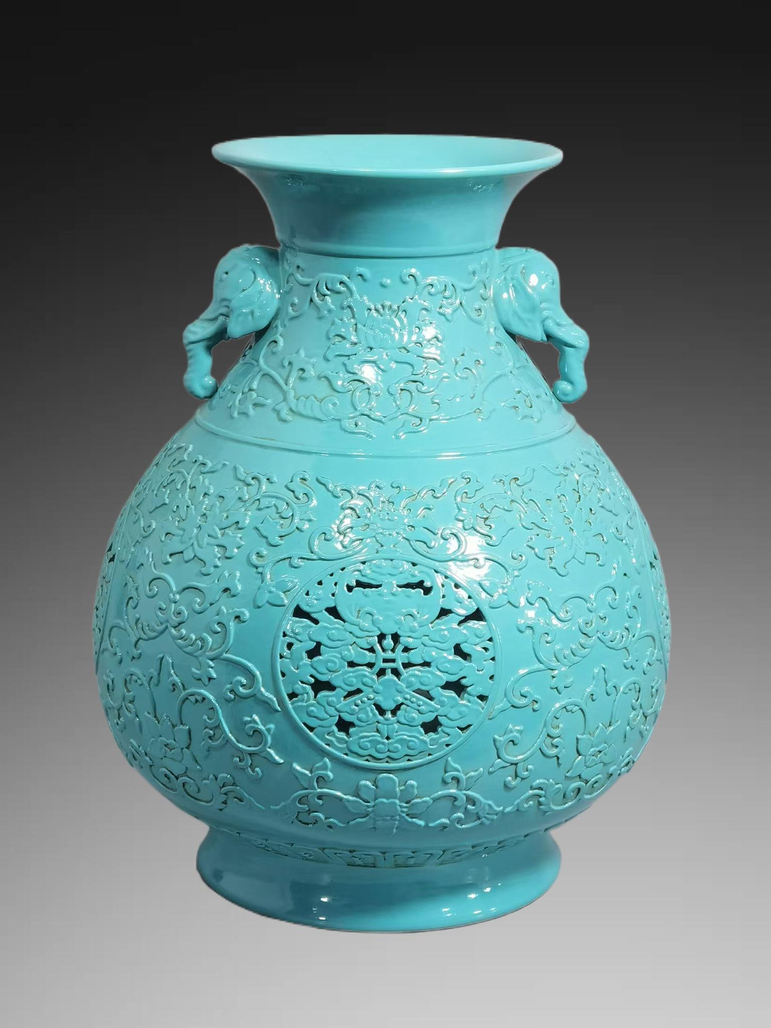 An Exquisite Turquoise-Glazed Hollow Lotus Pattern Elephant-Ears Vase: An Exquisite Turquoise-Glazed Hollow Lotus Pattern Elephant-Ears Vase,Qing Dynasty, China,Qianlong Six-character Mark,Size:11.2inx5.1inx8.7in 松石绿釉镂空缠&#