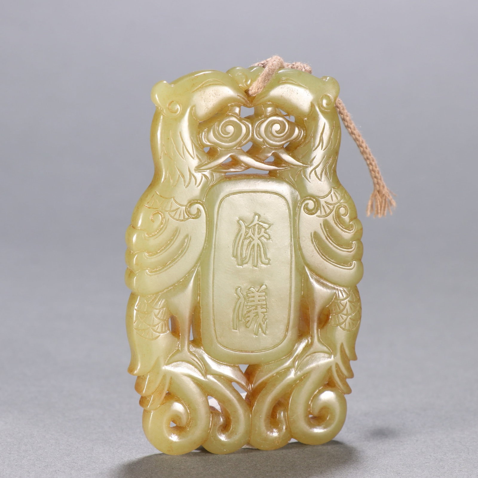 An Exquisite Hotan Yellow Jade Phoenix Pendant: An Exquisite Hotan Yellow Jade Phoenix Pendant,Qing Dynasty, China,Size:3.1inx2in,Weight:69.1g 和田黄玉凤牌,中国清代