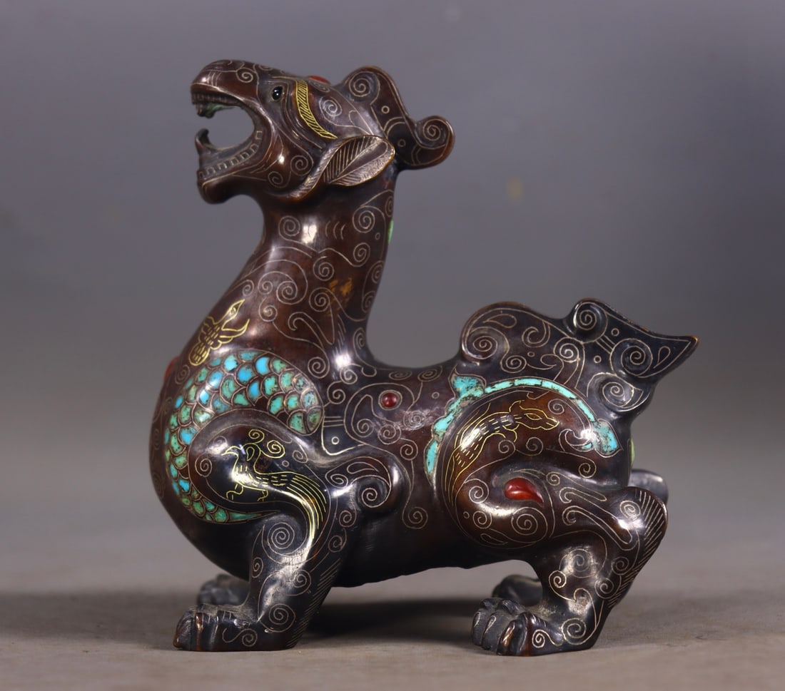An Exquisite Bronze Gold and Silver-Inlaid Turquoise Auspicious Beast Ornament: An Exquisite Bronze Gold and Silver-Inlaid Turquoise Auspicious Beast Ornament,Han Dynasty, China,Size:4.9inx4.5inx2.6in,Weight:694g