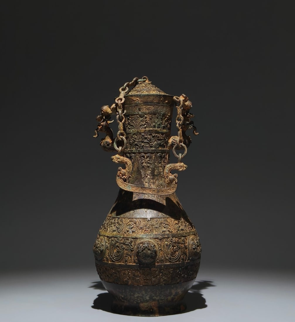 An Exquisite Bronze Dragon Pattern Chain Vase: An Exquisite Bronze Dragon Pattern Chain Vase,Han Dynasty, China,Size:12.2inx5.1in 青铜龙纹链条瓶,中国汉代