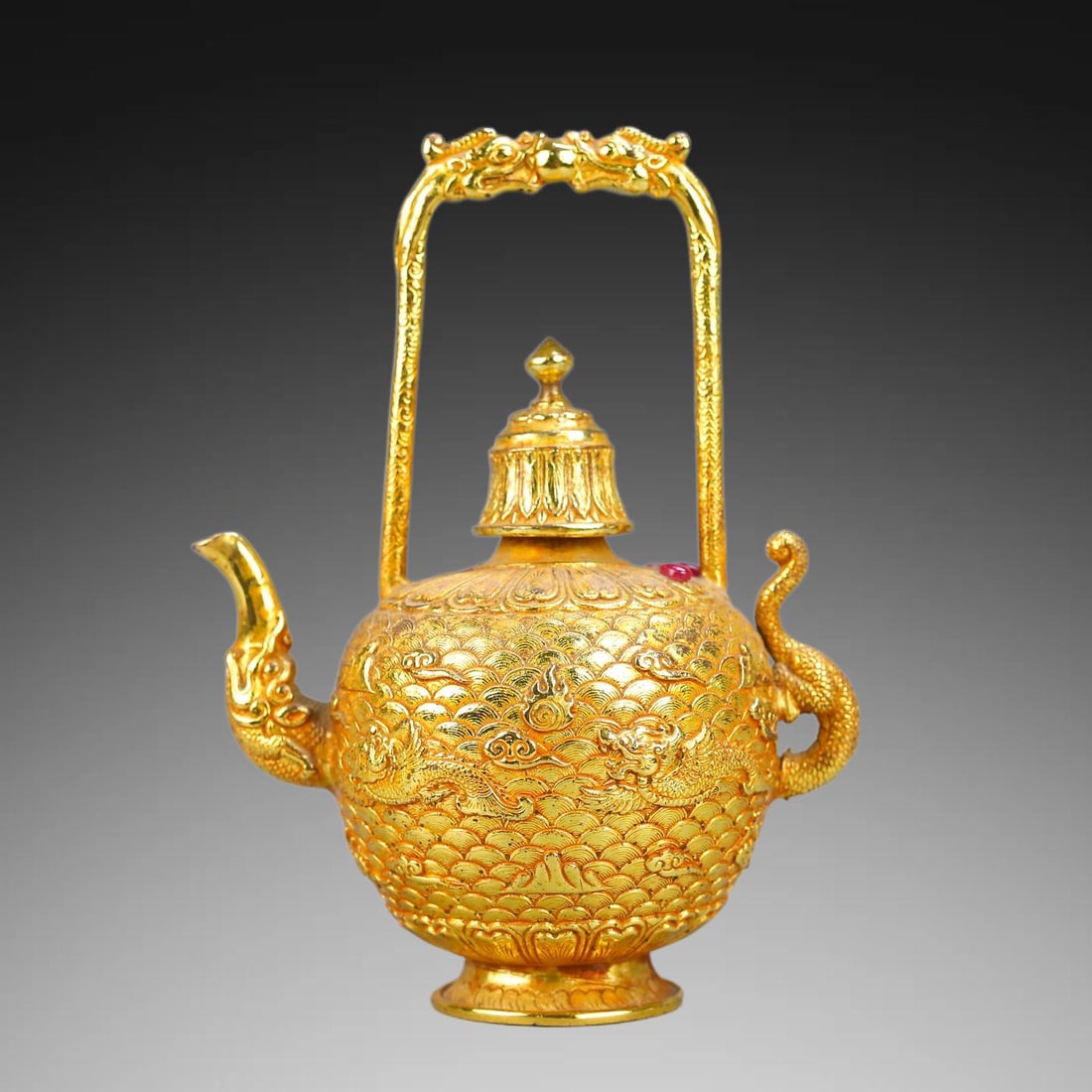 An Exquisite Gilt Copper Relief Dragon Head Ewer: An Exquisite Gilt Copper Relief Dragon Head Ewer,Qing Dynasty, China,Size:7.1inx5.1in ,Weight:685g 铜镀金浮雕龙首执壶,中国清