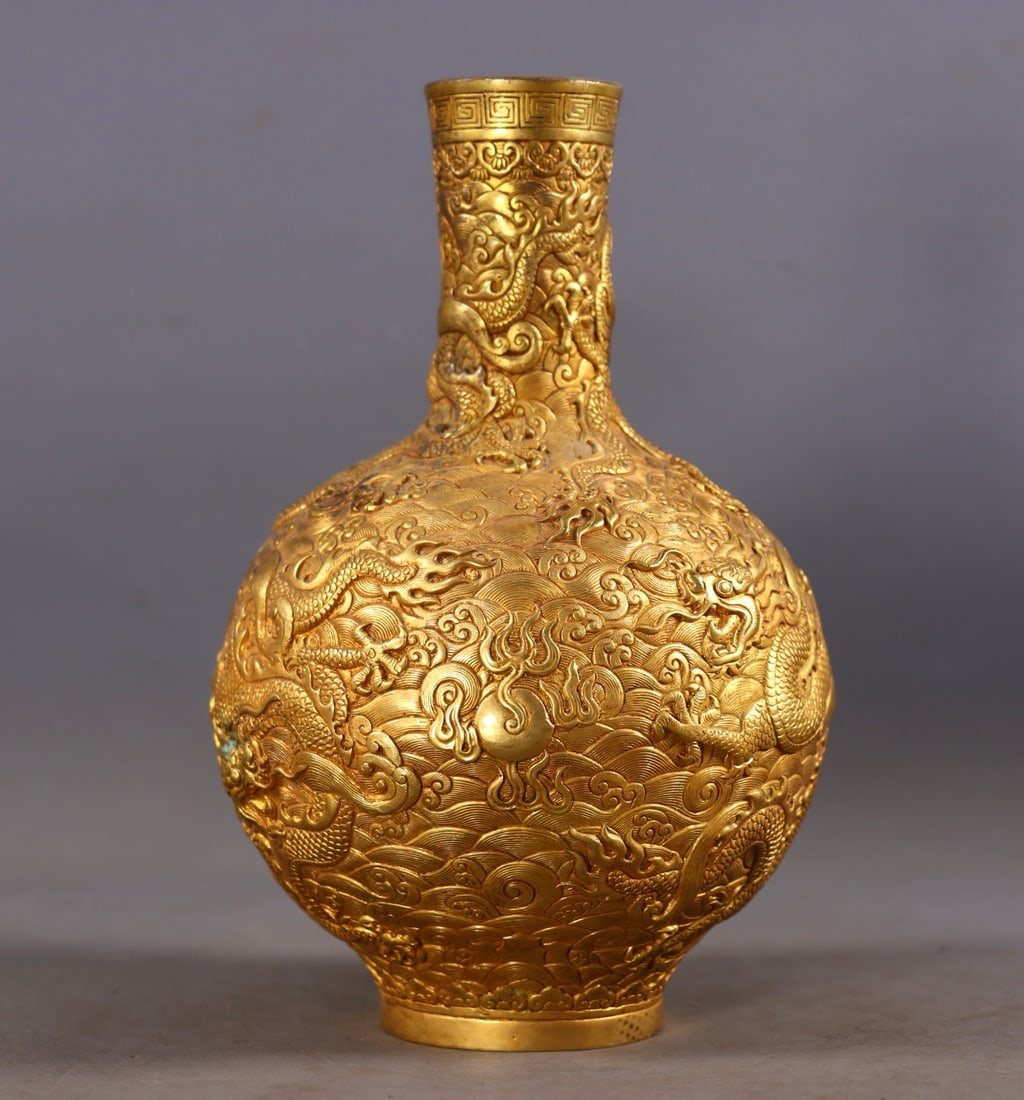 An Exquisite Gilt Bronze Dragon Pattern Vase: An Exquisite Gilt Bronze Dragon Pattern Vase,Qing Dynasty, China,Qianlong Four-character Mark,Size:7.7in(Height),4.3in(BellyDiameter),Weight:1312g 铜鎏金龙纹瓶,