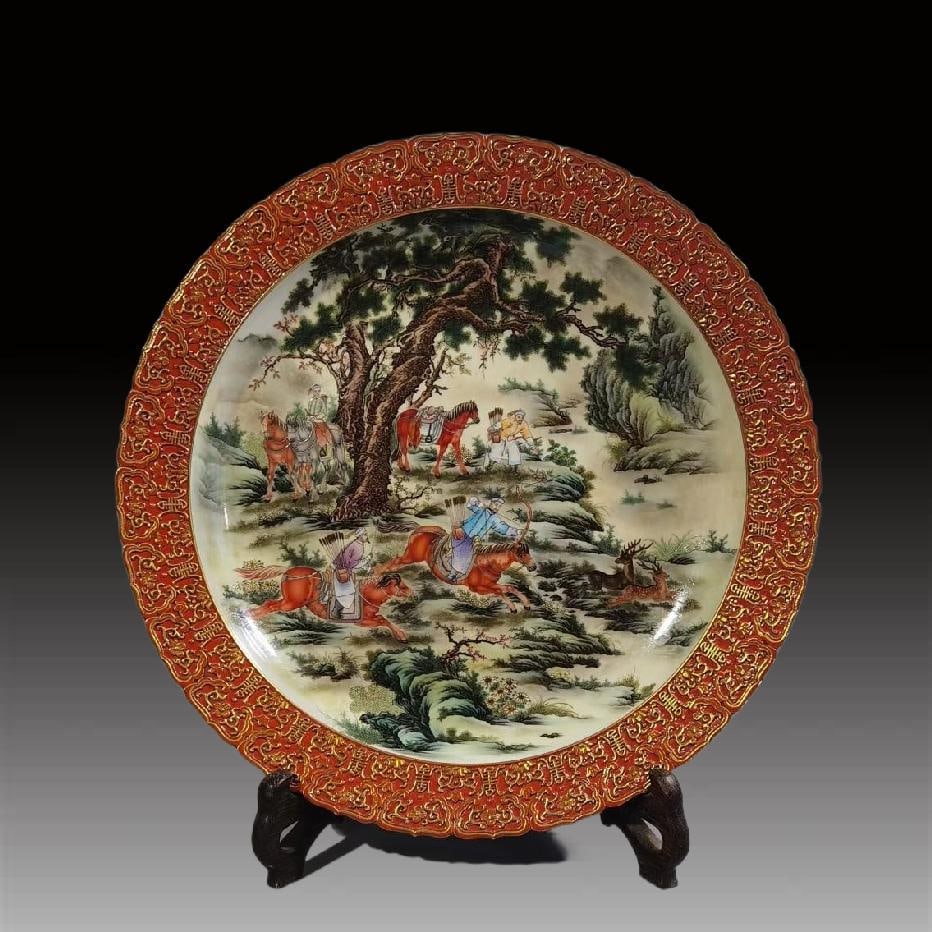 An Exquisite Coral Red Glazed Painted Gold Enamel Hunting Pattern Plate: An Exquisite Coral Red Glazed Painted Gold Enamel Hunting Pattern Plate,Qing Dynasty, China,Qianlong Six-character Mark,Size:3.1inx17.9inx10.8in