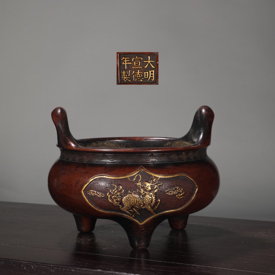 An Exquisite Gilt Bronze Auspicious Cloud and Kylin Pattern Double-Ears Tripod Censer: An Exquisite Gilt Bronze Auspicious Cloud and Kylin Pattern Double-Ears Tripod Censer,Ming Dynasty,China,Xuande Six-character Mark,Size:6.3inx7.3inx8.3in,Weight:5100g铜鎏金祥&#