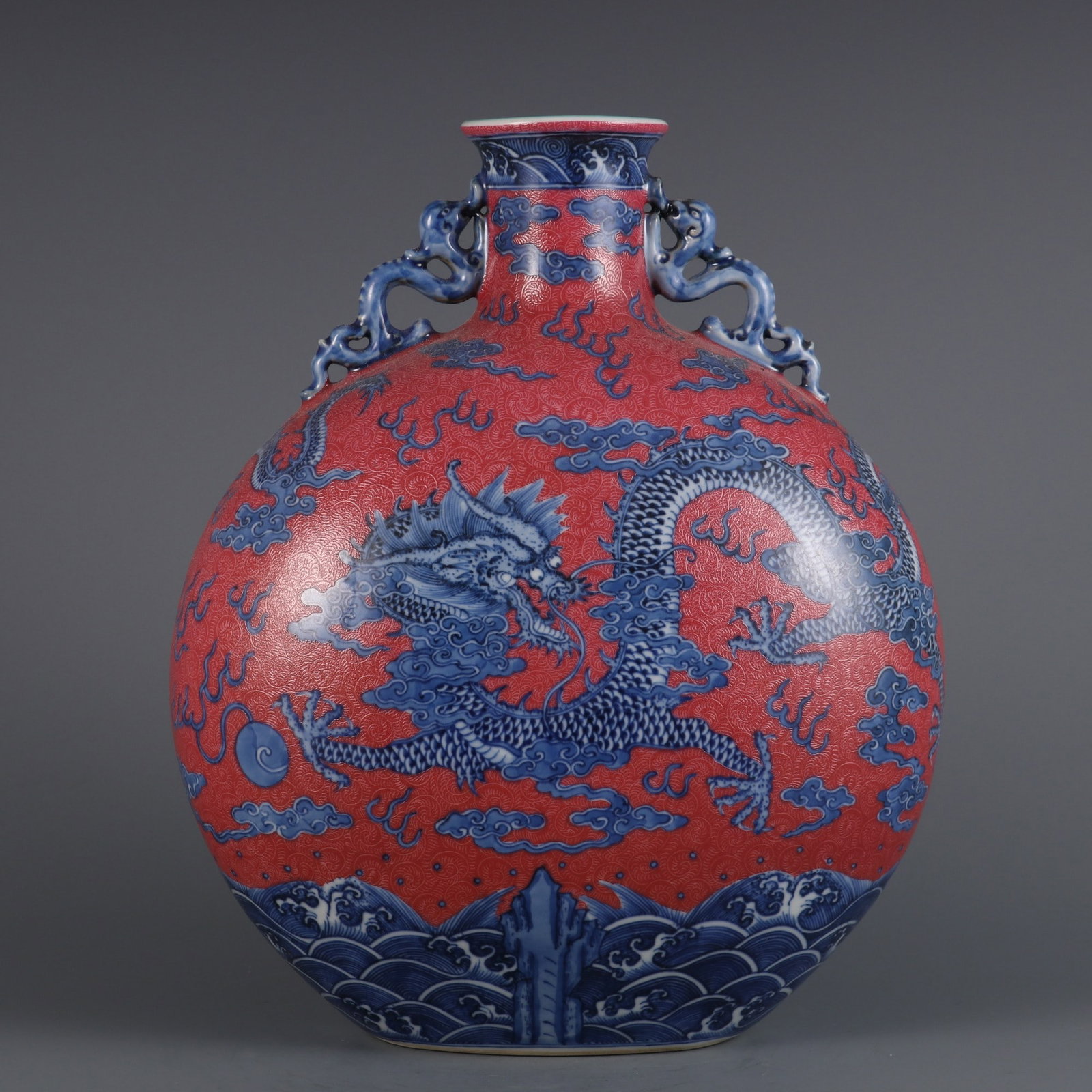 A Exquisite Blue and White Ruby Red-Glazed Auspicious Cloud Pattern Dragon Pattern Double-Ears Vase: A Exquisite Blue and White Ruby Red-Glazed Auspicious Cloud Pattern Dragon Pattern Double-Ears Vase Qing Dynasty, China Qianlong Six-character Mark Size:11.9inx9.1in青花加胭