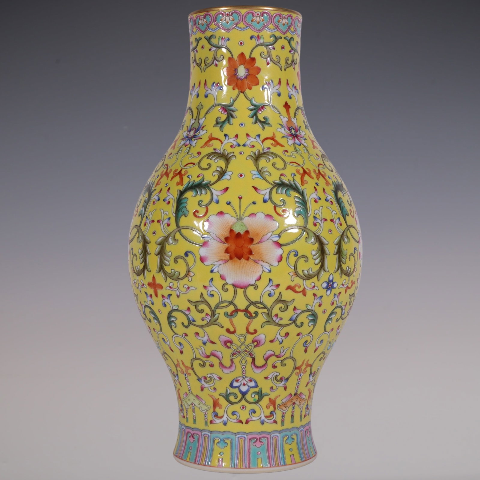 An Exquisite Enamel Yellow Ground Painted Gold Lotus Pattern Vase: An Exquisite Enamel Yellow Ground Painted Gold Lotus Pattern Vase,Qing Dynasty, China,Qianlong Six-character Mark,Size:10.9inx5.3in珐琅彩黄地描金缠ĉ