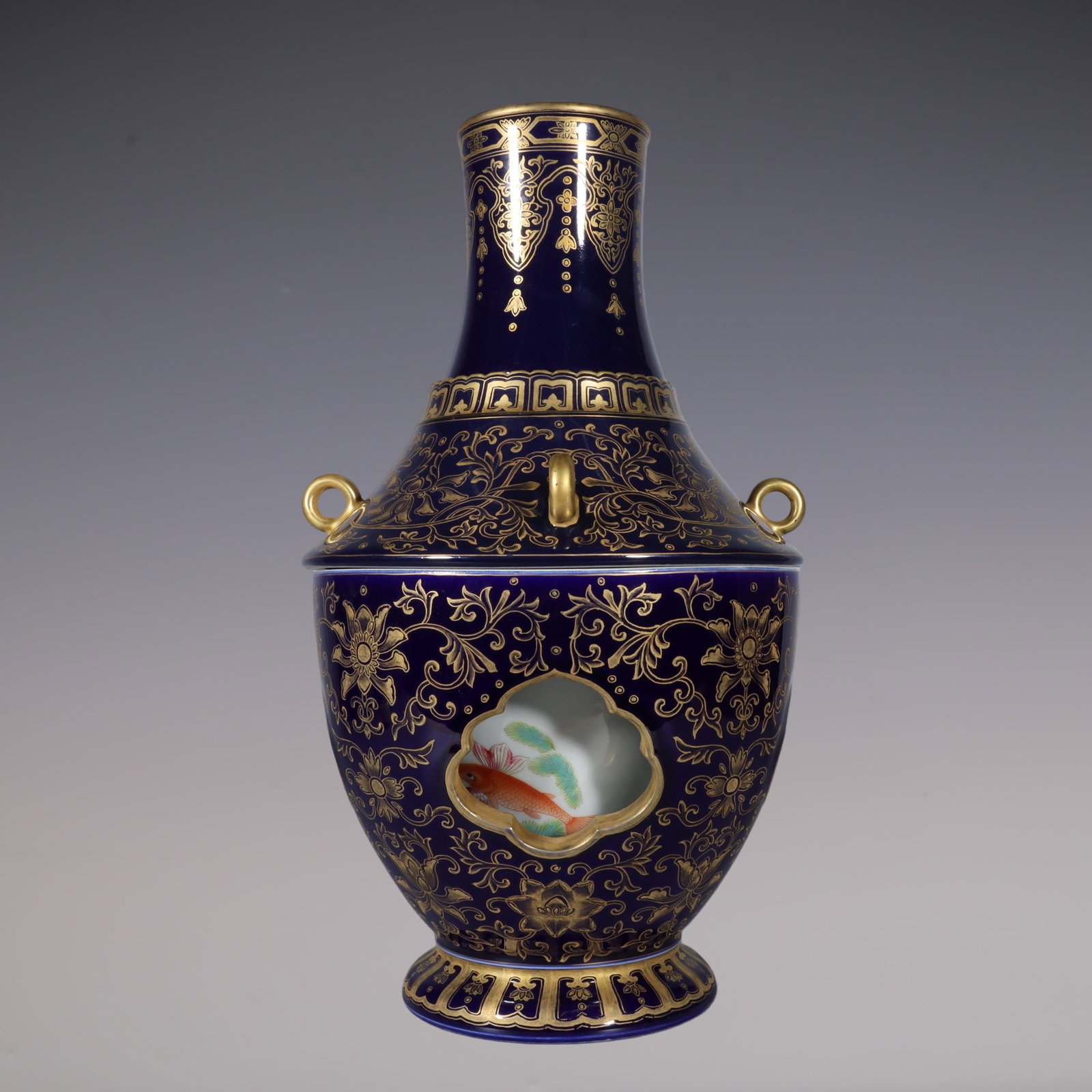 A Rare Famille-Rose Ji Blue Glazed Painted Gold Lotus and Fish Pattern Vase: A Rare Famille-Rose Ji Blue Glazed Painted Gold Lotus and Fish Pattern Vase,Qing Dynasty, China,Qianlong Six-character Mark,Size:15.1inx3.4inx5.4in粉彩霁蓝釉描ŵ