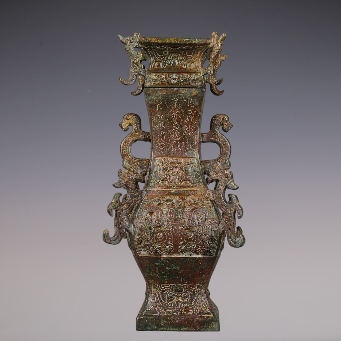 An Archaic Bronze Beast-Face Pattern Dragon-Ears Vase with Cover,With Inscription: An Archaic Bronze Beast-Face Pattern Dragon-Ears Vase with Cover,With Inscription,W.Zhou ,