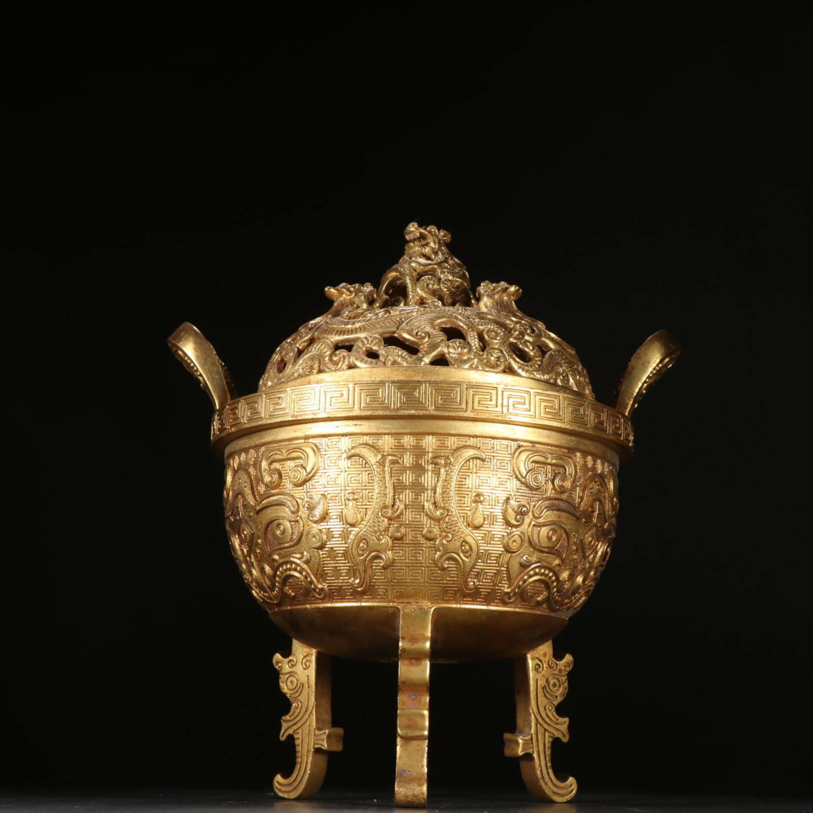 An Exquisite Gilt Bronze Tripod Incense Burner Carved With Beast Mask Pattern: An Exquisite Gilt Bronze Tripod Incense Burner Carved With Beast Mask Pattern,China Qing Dynasty,Dimensions:8.7inx6.2in,Weight:3824g,铜鎏金兽面纹三足