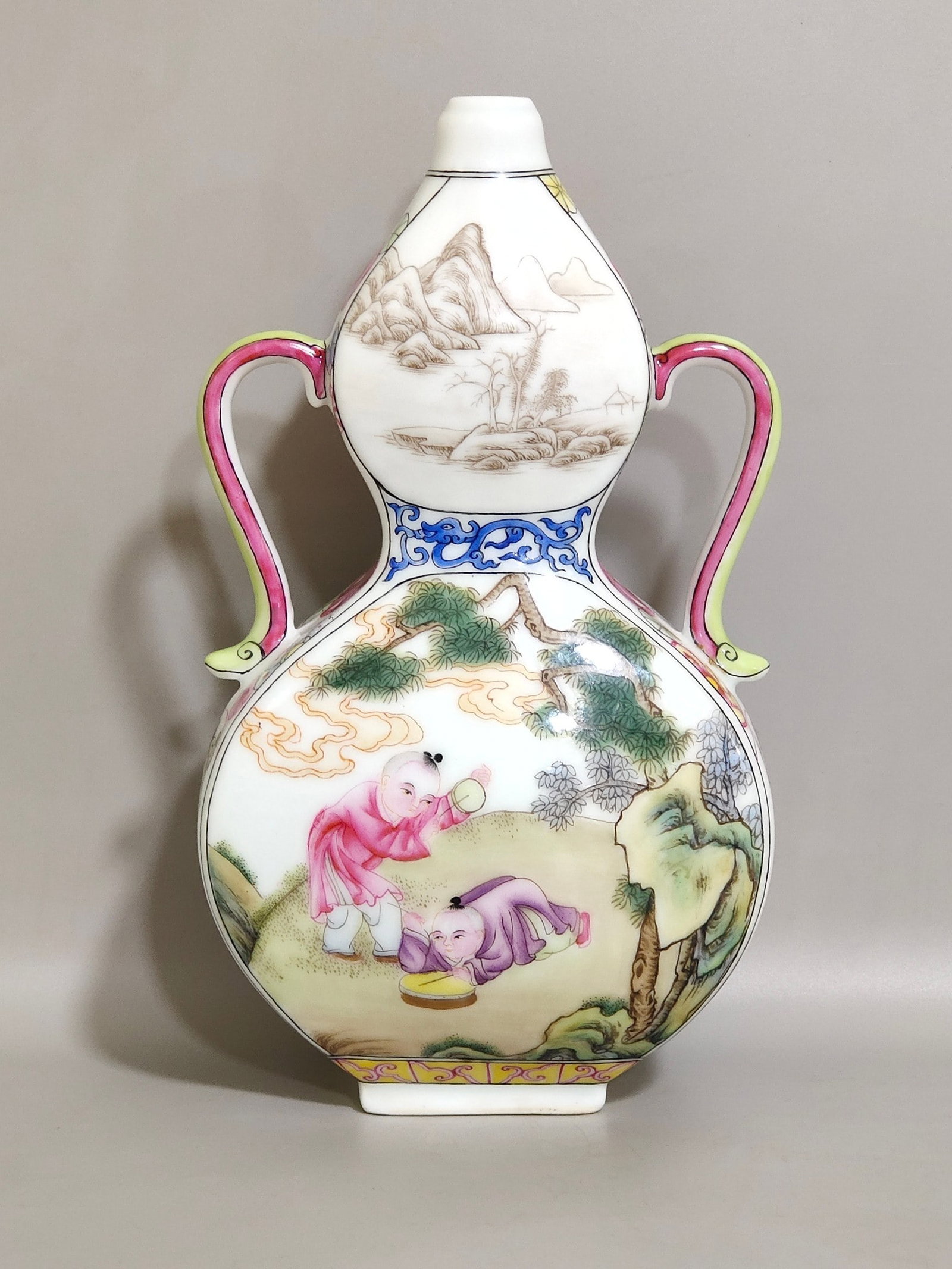 An Exquisite Flat Gourd Vase With Ribbon-Shaped Ears Decorated With Famille Rose Landscape And: An Exquisite Flat Gourd Vase With Ribbon-Shaped Ears Decorated With Famille Rose Landscape And Children-At-Play Patterns,Qing Dynasty,China,Qianlong Four-character Mark,粉彩婴戏