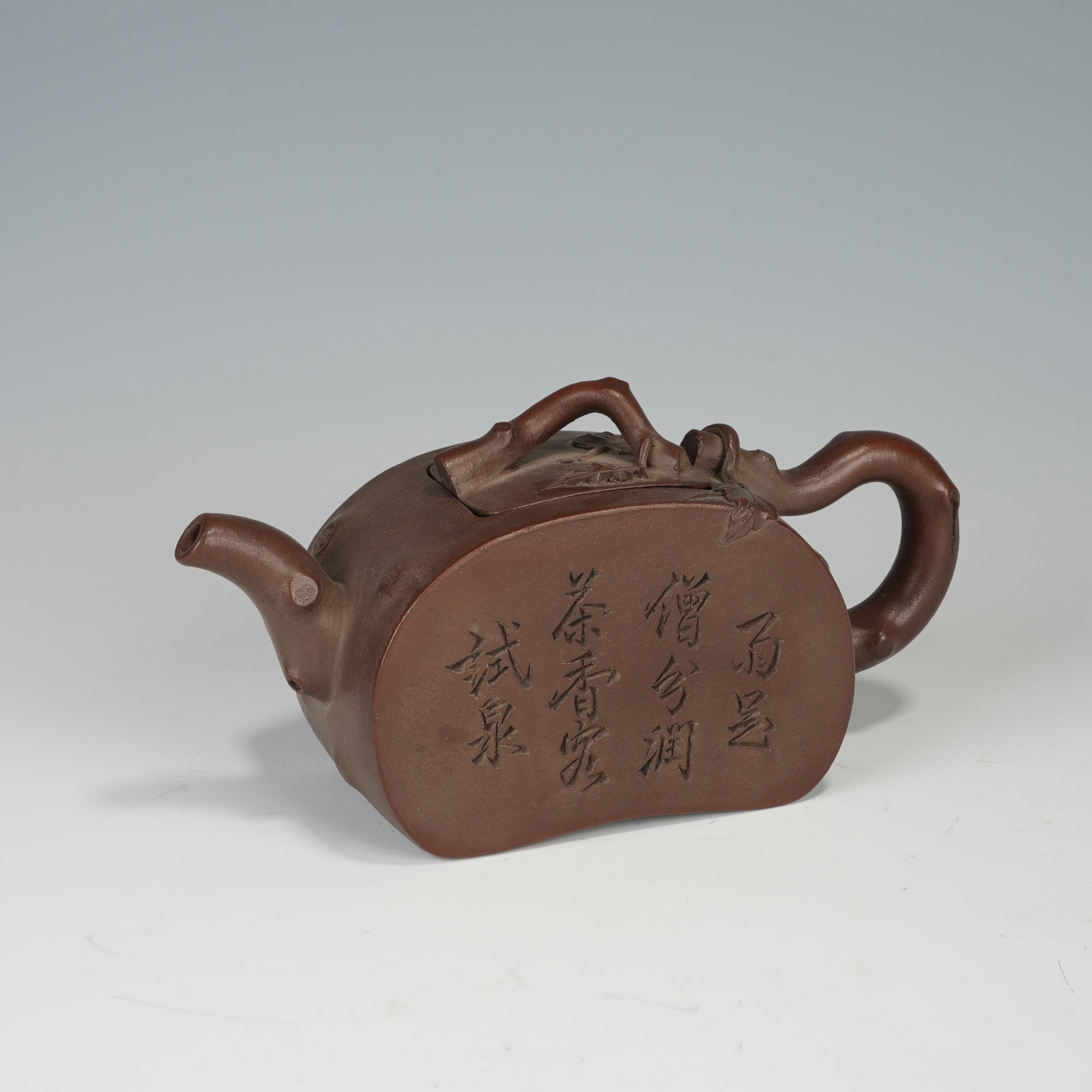 An Exquisite Yixing Zisha Tree-Stump Pot With Poem Inscription: An Exquisite Yixing Zisha Tree-Stump Pot With Poem Inscription,Qing Dynasty,China,Four-Character Qianlong Mark. Dimensions:6.7inx2.4inx3.1in,紫砂树桩诗文壶,&#