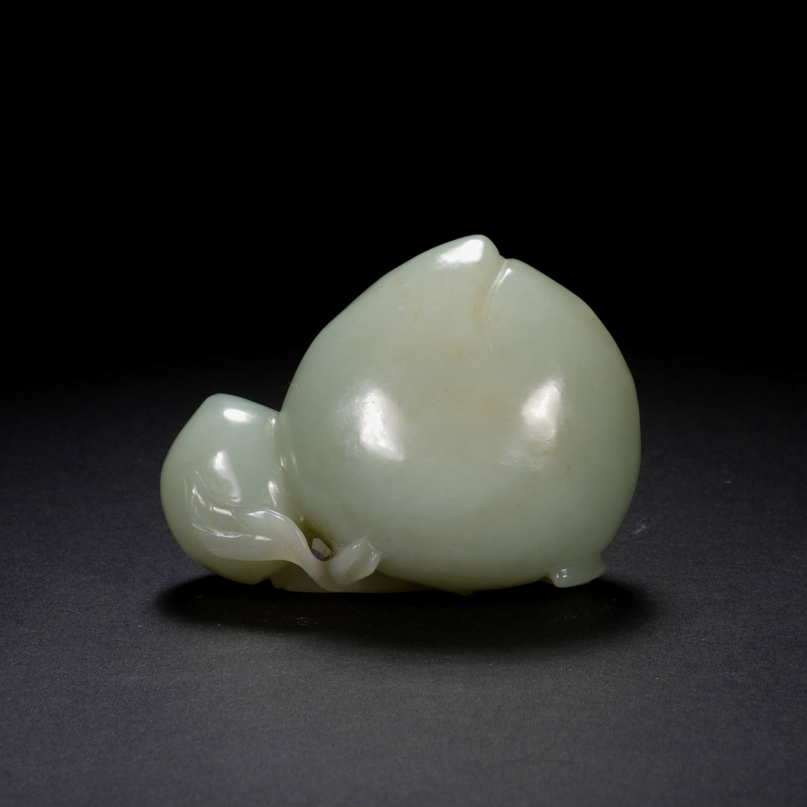 An Exquisite White Jade Peach-Shaped Brush Rest (1 of 6)