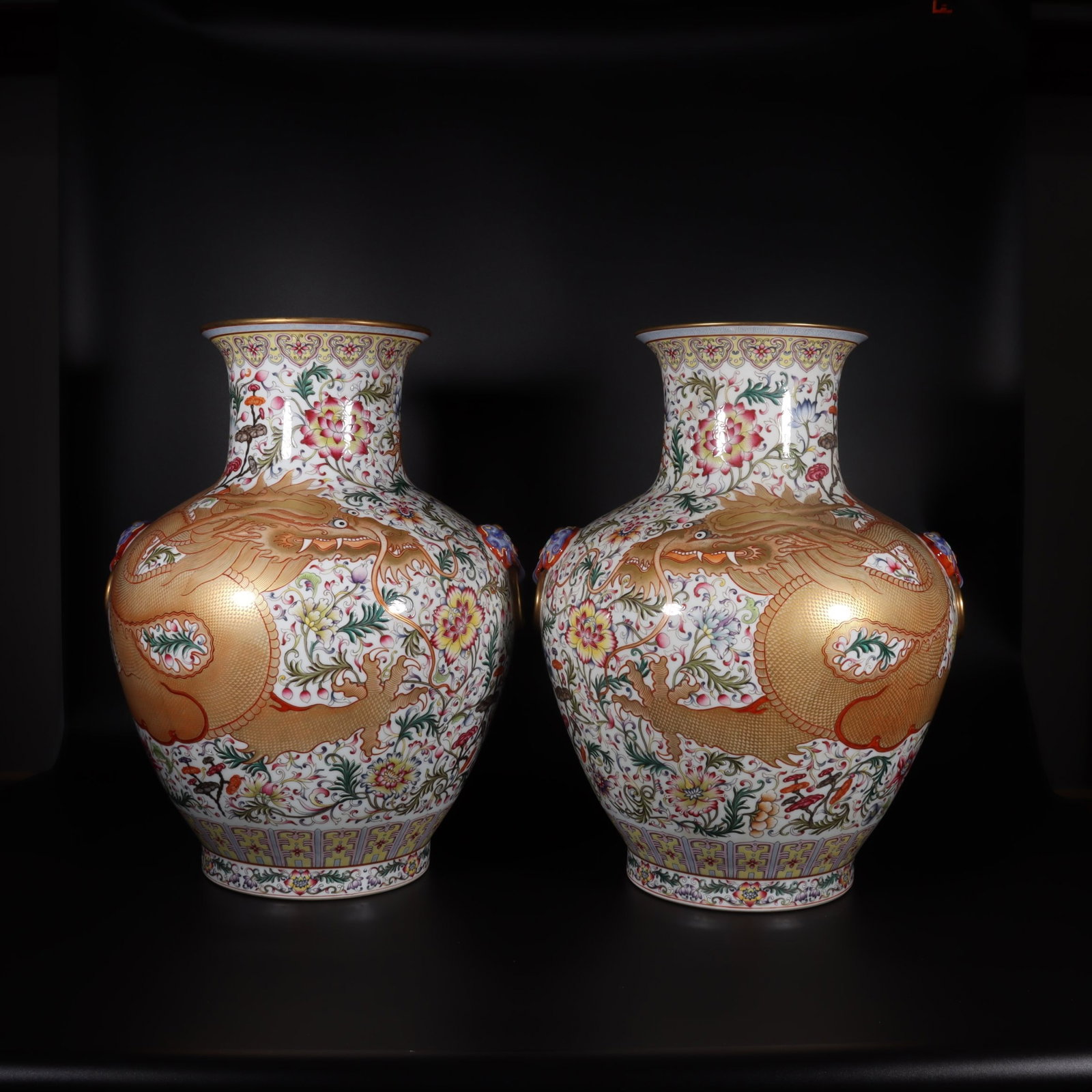 A Pair of Fine Famille Rose White Ground Gilt Lion-Eared Vases,Dragons Amid Delicate Flowers: A Pair of Fine Famille Rose White Ground Gilt Lion-Eared Vases,Dragons Amid Delicate Flowers,Qing Dynasty,China,Qianlong Four-character Mark,Size:20.5inx8.5inx8.5in,一对粉彩