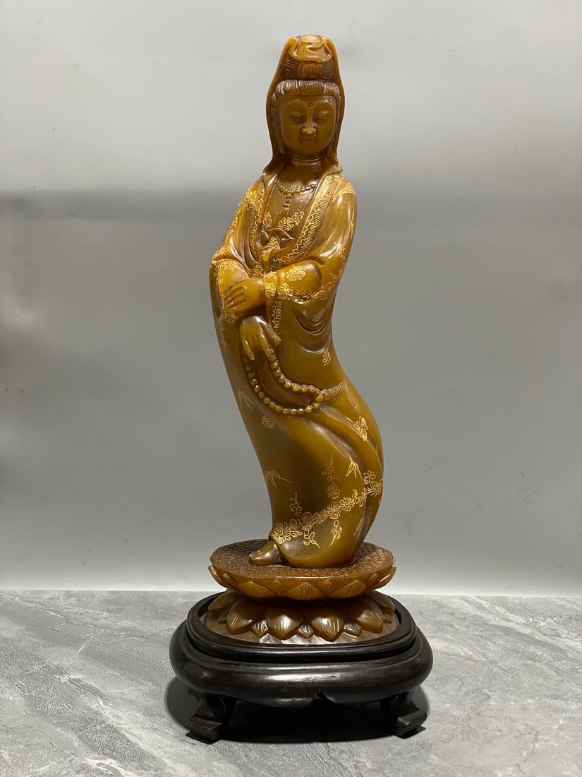 A Fine Tianhuang Stone Standing Guanyin Statue: A Fine Tianhuang Stone Standing Guanyin Statue,Qing Dynasty Of China,With Inscription,Dimensions:11inx3.7inx2.8in,Weight:1336g,田黄石观音立像,中国