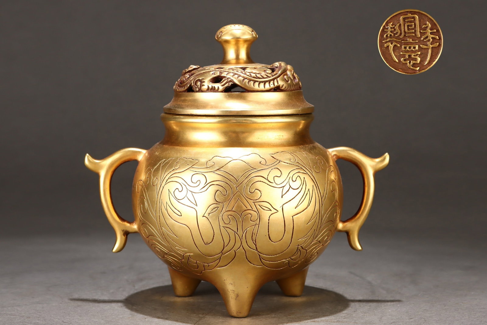An Exquisite Gilt Bronze Three-legged Loop-handled Incense Burner with Phoenix Amity Pattern: An Exquisite Gilt Bronze Three-legged Loop-handled Incense Burner with Phoenix Amity Pattern,Chinese,Ming Dynasty,Four-character Xuande