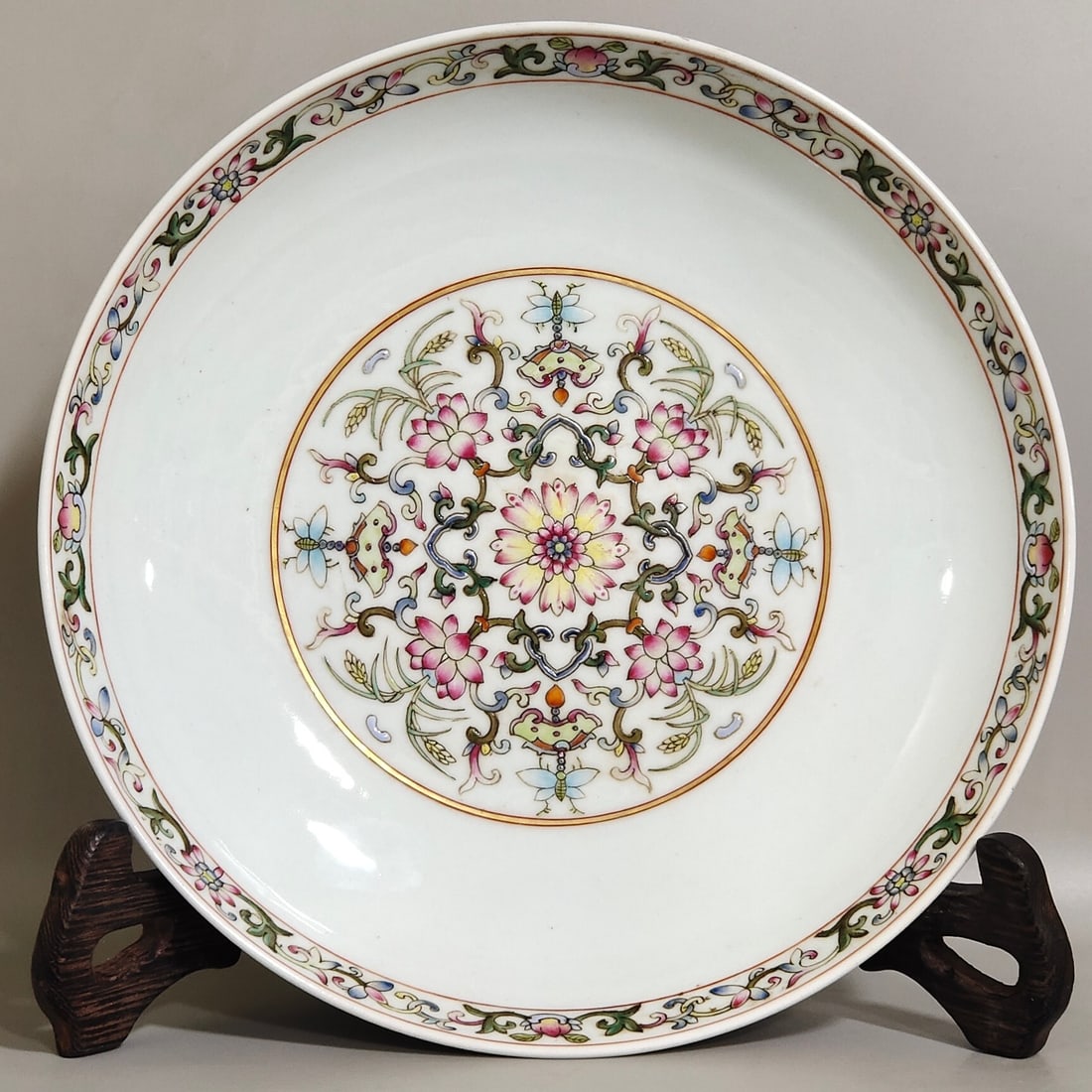 An Exquisite Ornamental Plate Painted With Famille Rose Treasure Flowers,Eight Auspicious Symbols: An Exquisite Ornamental Plate Painted With Famille Rose Treasure Flowers,Eight Auspicious Symbols And Interlocking Floral Vines,Qing Dynasty,China,With
