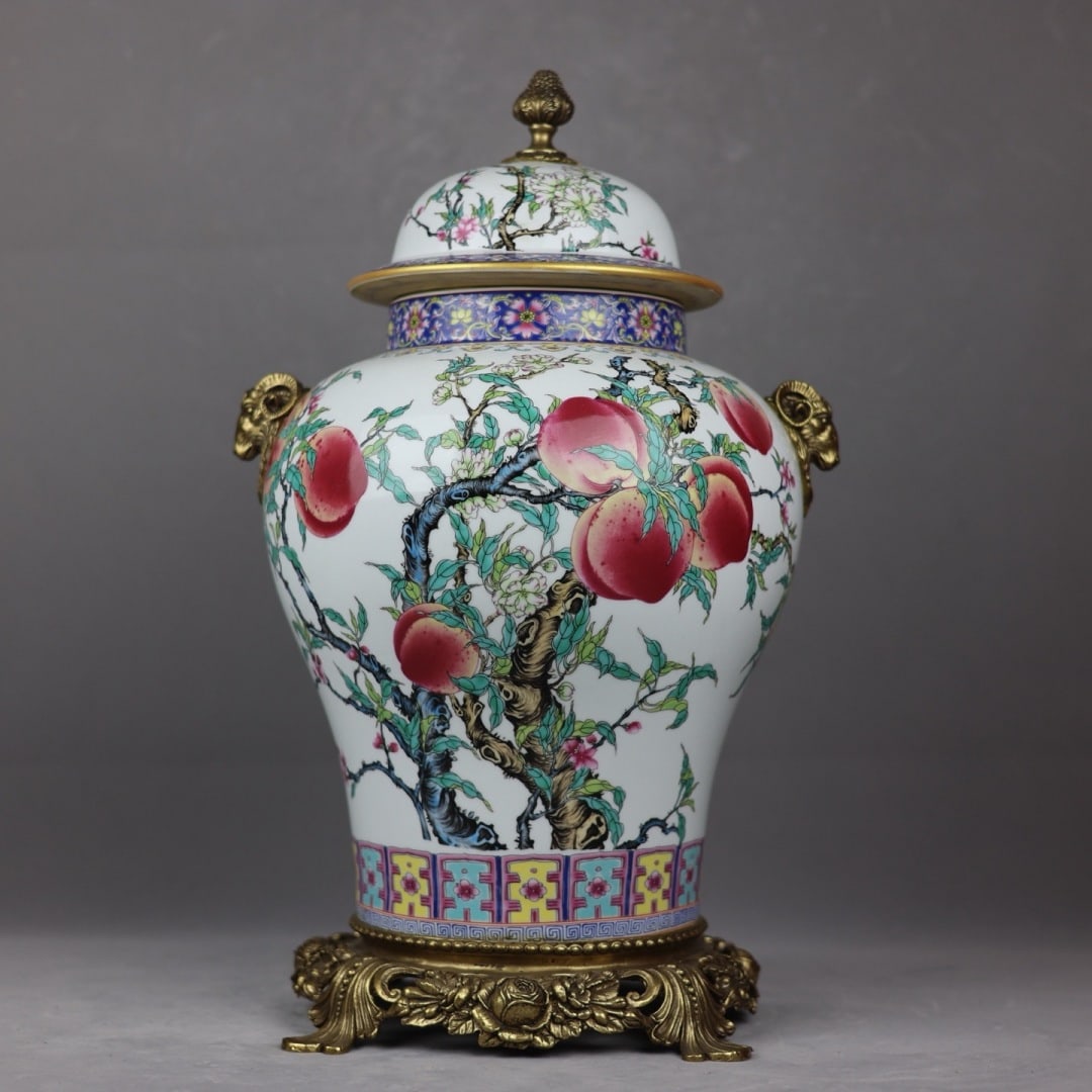 An Exquisite Famille Rose General Jar With Double Copper Sheep Head Ears,Nine Peaches Pattern: An Exquisite Famille Rose General Jar With Double Copper Sheep Head Ears,Nine Peaches Pattern,China Qing Dynasty,Four-Character Qianlong Mark,Dimensions:20.1inx11.8in,粉彩九桃&