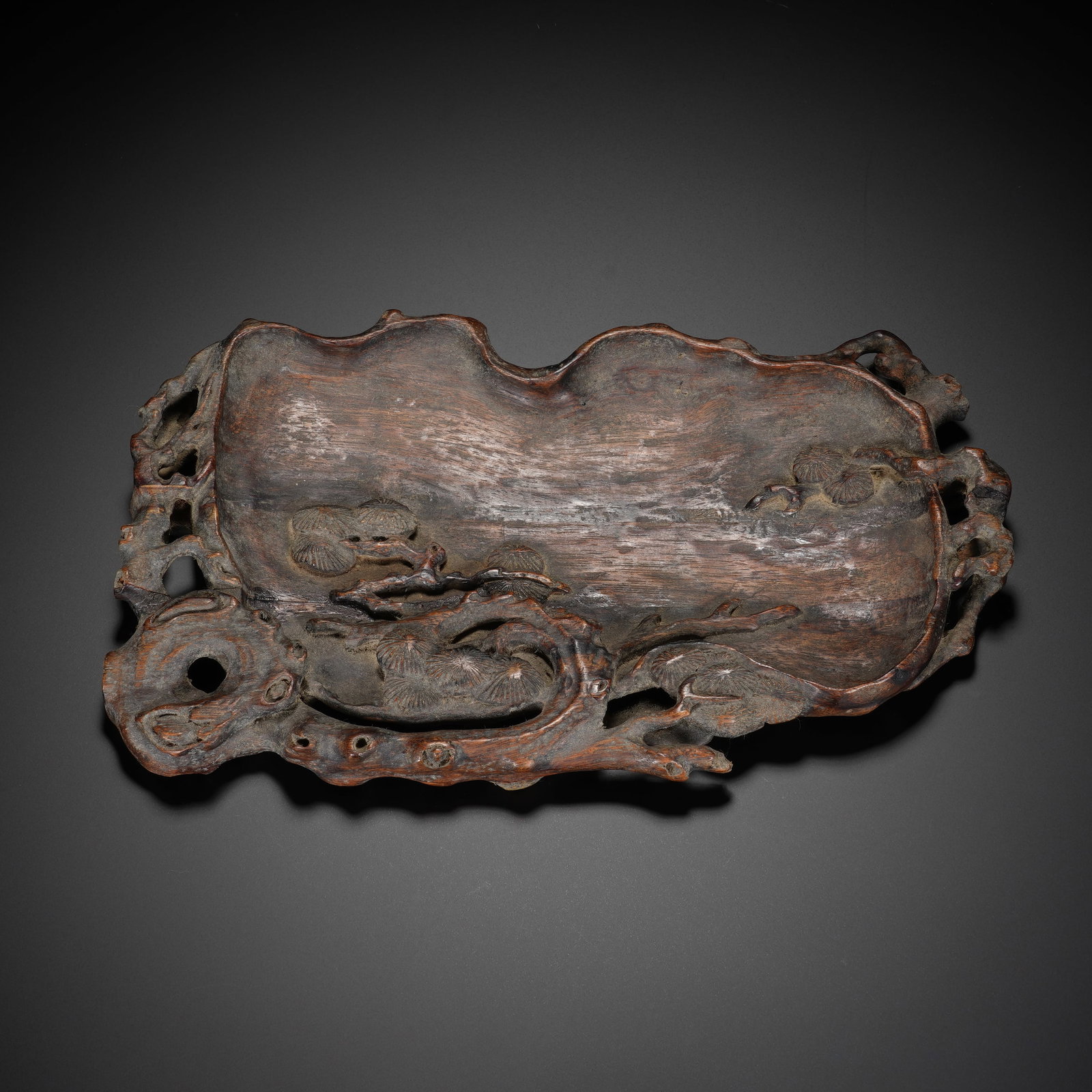 An Exquisite Huanghuali Wood Free-Form Ink Palette With Pine Tree Pattern: An Exquisite Huanghuali Wood Free-Form Ink Palette With Pine Tree Pattern,Qing Dynasty,China,With Mark,Dimensions:8.3inx4.7inx0.8in,黄花梨木苍松纹随