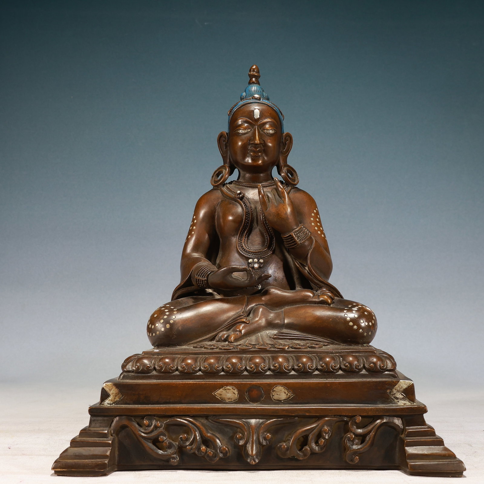 A Solemn Bronze Inlaid Silver Buddha Statue: A Solemn Bronze Inlaid Silver Buddha Statue,Qing Dynasty, China,Size:11.8inx9.8inx14.2in,Weight:11900g 铜嵌银佛像,中国清代