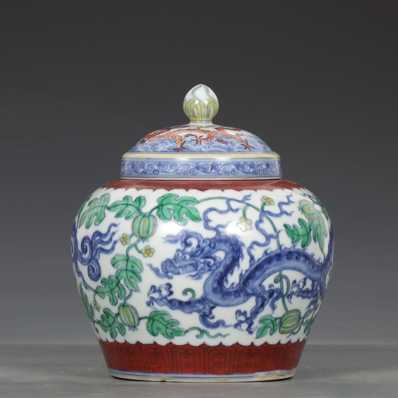 An Exquisite Doucai "Tian" Mark Jar With Dragons Winding Through Melon Ground Patterns (1 of 8)
