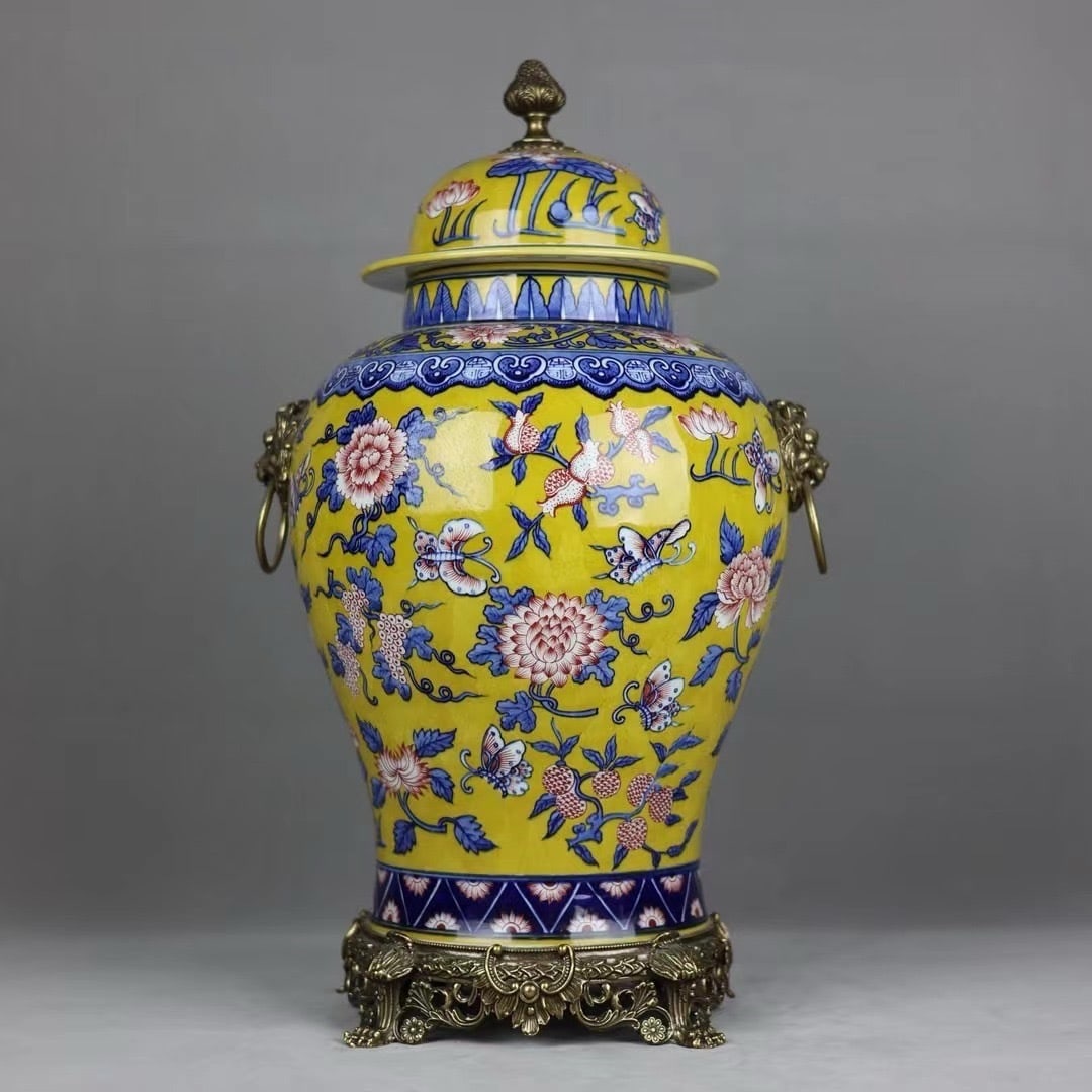 An Exquisite General Jar With Double Lion Ring Ears And Copper Trim,Underglaze Red And Blue And: An Exquisite General Jar With Double Lion Ring Ears And Copper Trim,Underglaze Red And Blue And White Pattern On Yellow Ground,China Qing Dynasty,Six-Character Qianlong Mark,Dimensions:20.5inx11.4in,&