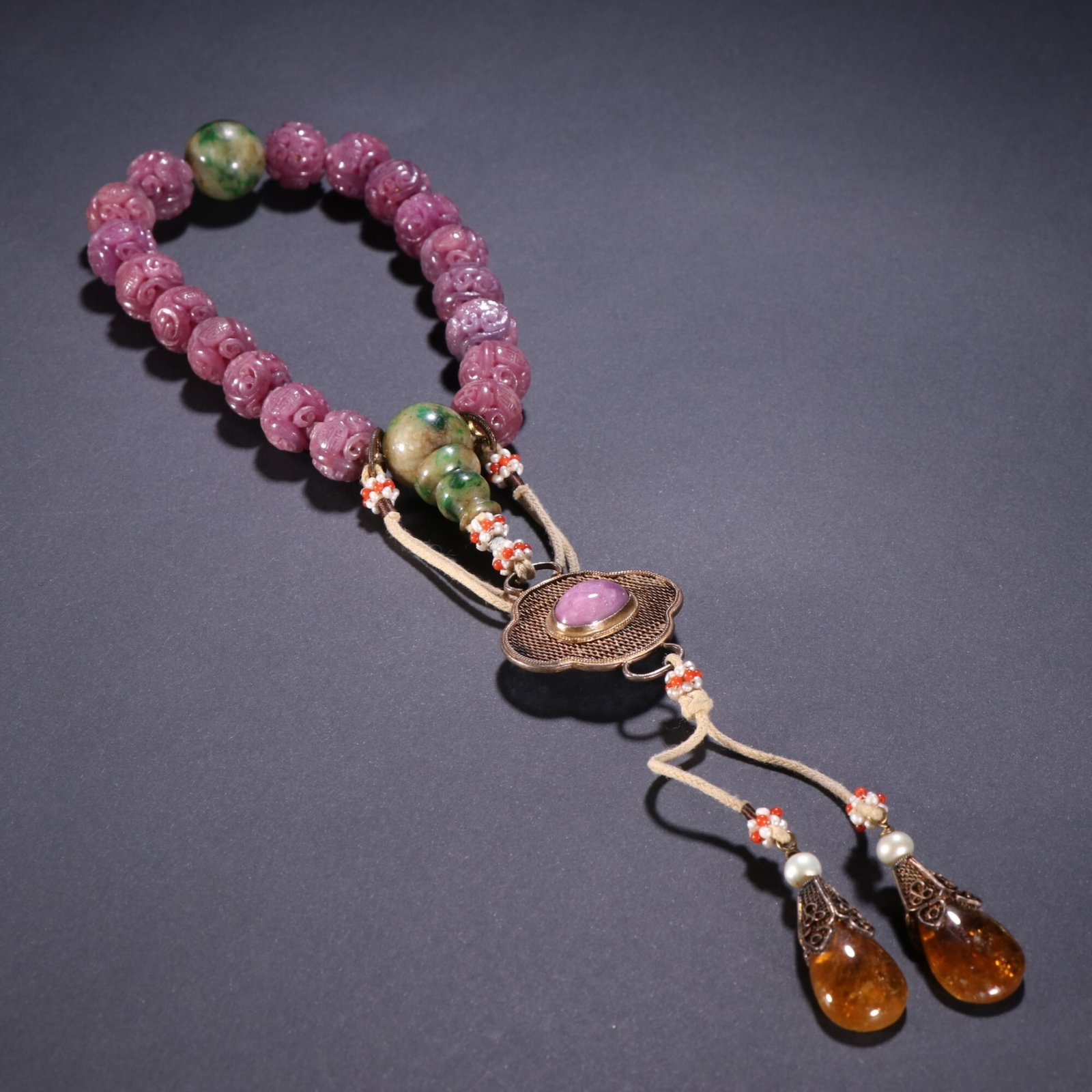 An Exquisite Ruby Hollow 18-Bead Prayer String With Twin Dragons Holding Longevity Character (1 of 9)