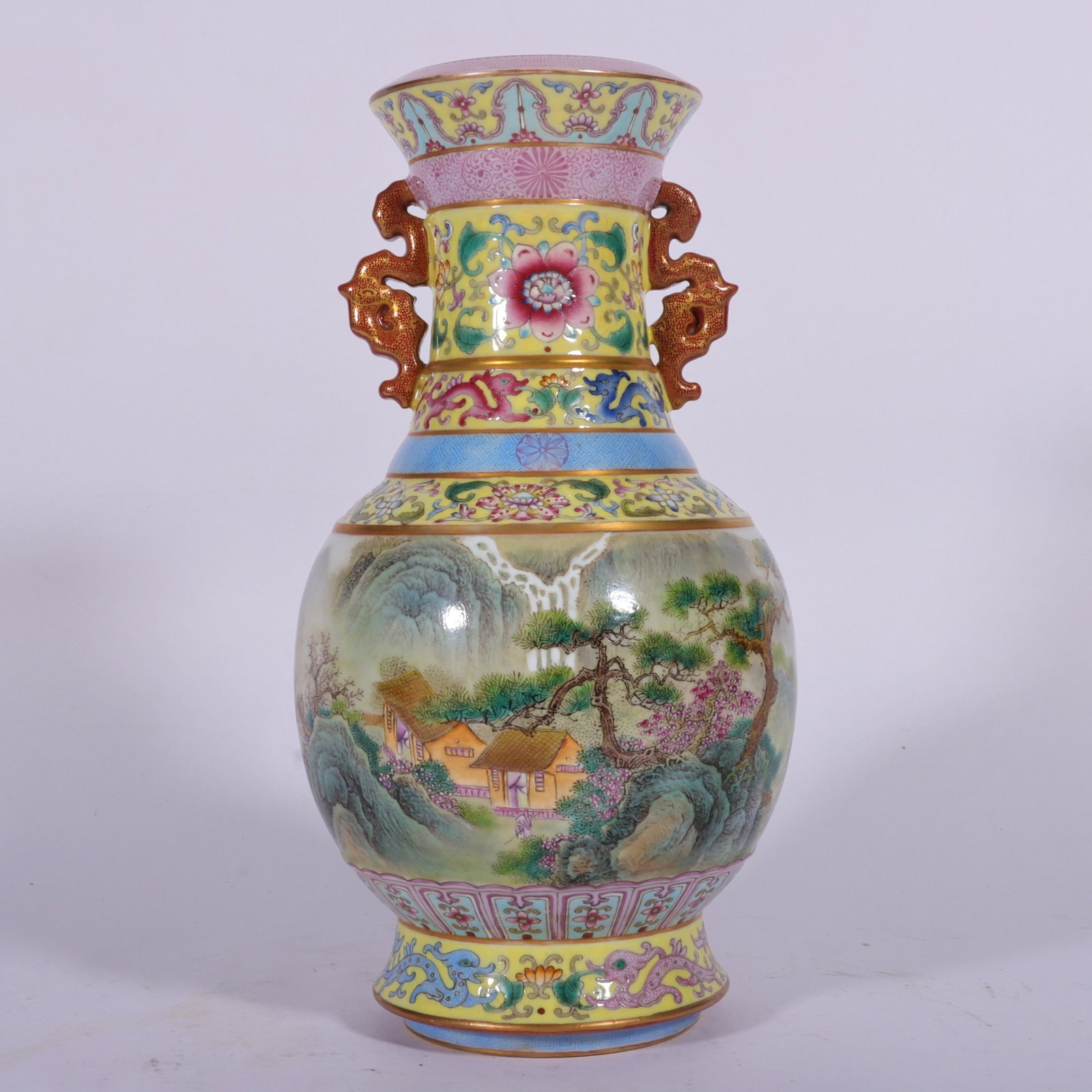A Fine Enamel Color Yellow Ground Continuous Landscape Double-Eared Vase: A Fine Enamel Color Yellow Ground Continuous Landscape Double-Eared Vase,Qing Dynasty,China,Qianlong Four-character Mark,Size:8.6inx3.1in,珐琅彩黄地通景ा