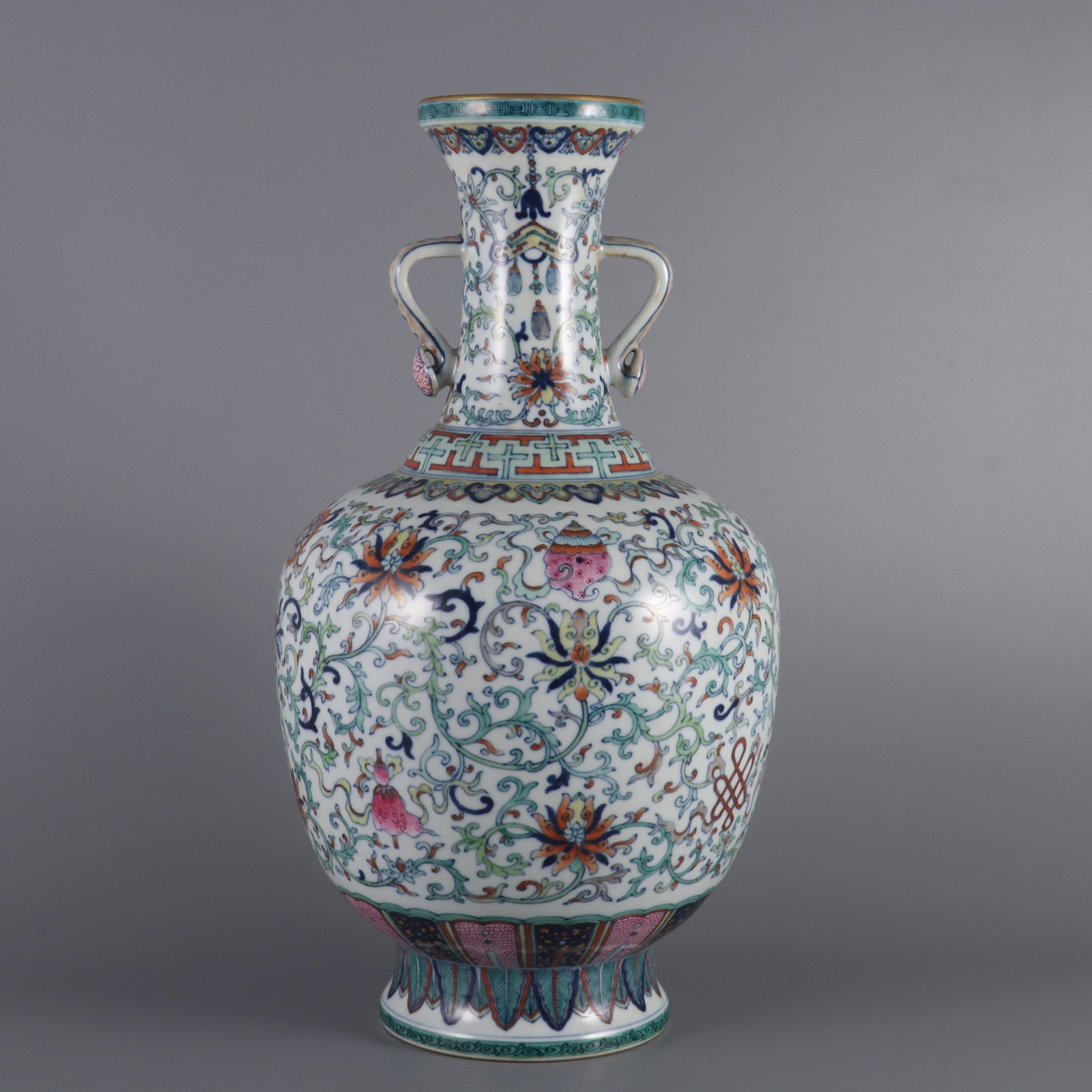 An Exquisite doucai interlocking lotus eight treasures ruyi-handle reward vase,: An Exquisite doucai interlocking lotus eight treasures ruyi-handle reward vase,Qing Dynasty, China,Qianlong Six-character Mark,Size:15.4inx8.1in,斗彩缠枝莲八宝