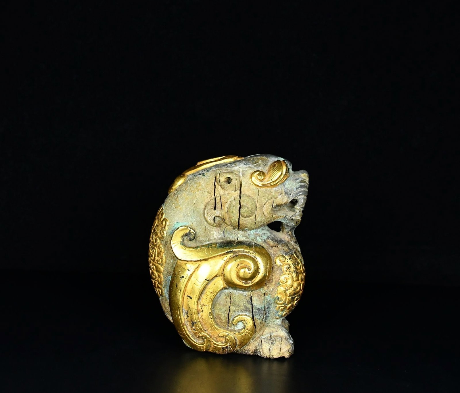 A Fine White Jade Crouching Auspicious Beast Ornament With Gilt?Gold Wrapping (1 of 9)