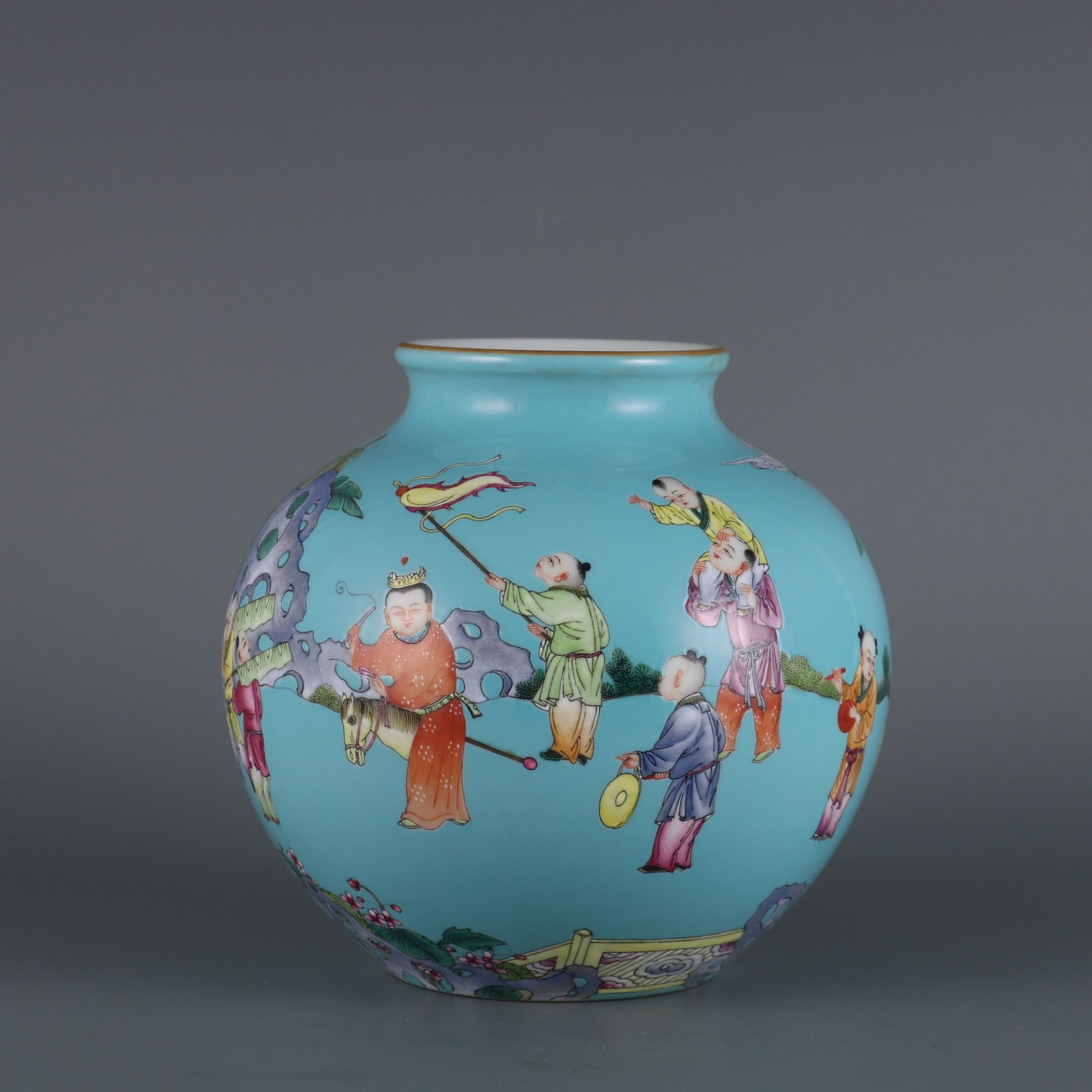 An Exquisite turquoise green ground famille rose children at play pomegranate-shaped jar, (1 of 9)