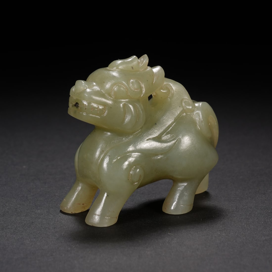 An Exquisite White Jade Qilin Ornament: An Exquisite White Jade Qilin Ornament,China,Qing Dynasty,Dimensions:1.6inx0.9inx1.5in,Weight:35g,白玉麒麟摆件,中国清代