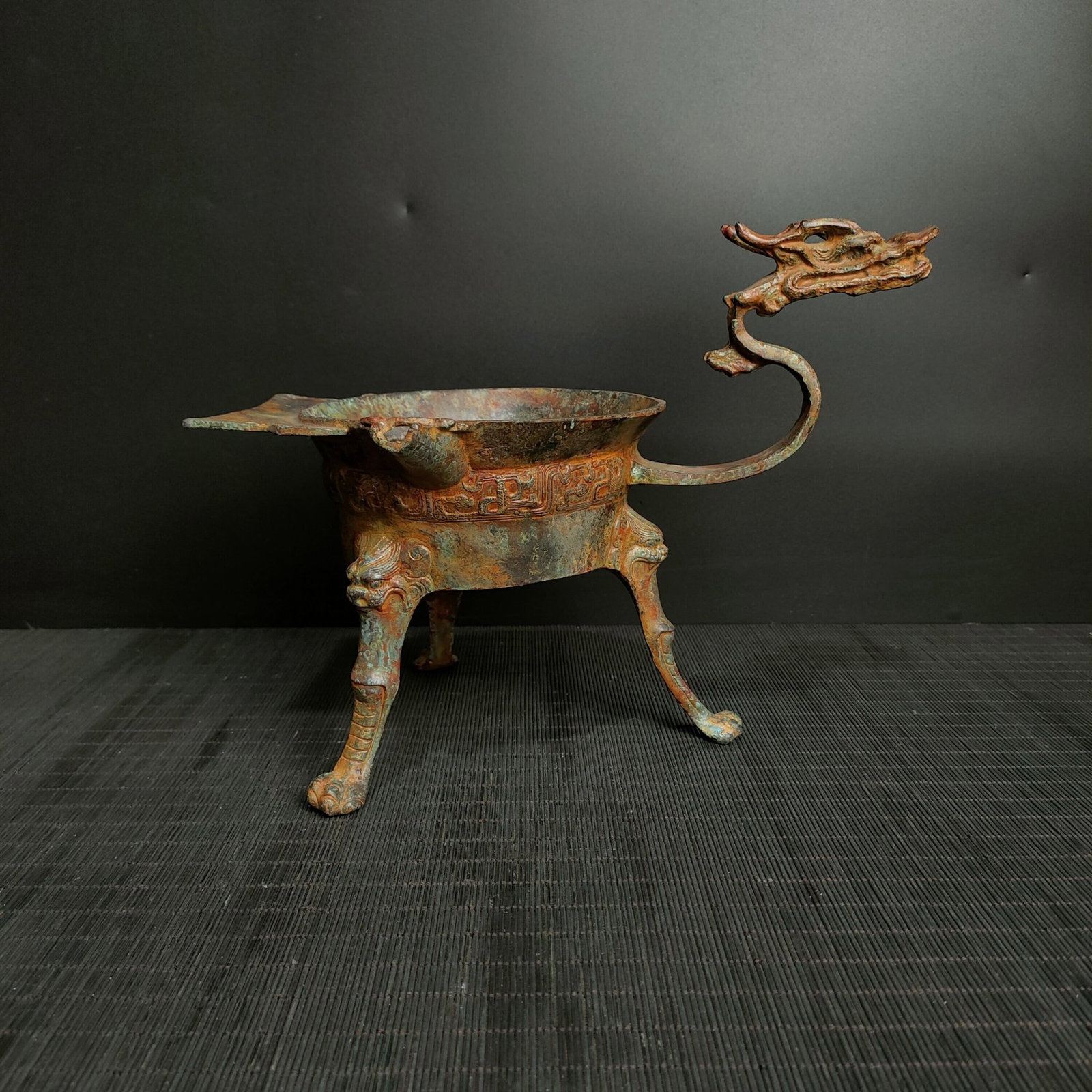 A Fine Bronze Dragon?Head Cup: A Fine Bronze Dragon‑Head Cup,Chinese Warring States Period,Dimensions:11inx8.7in,Weight:1600g,青铜龙头杯,中国战国时期