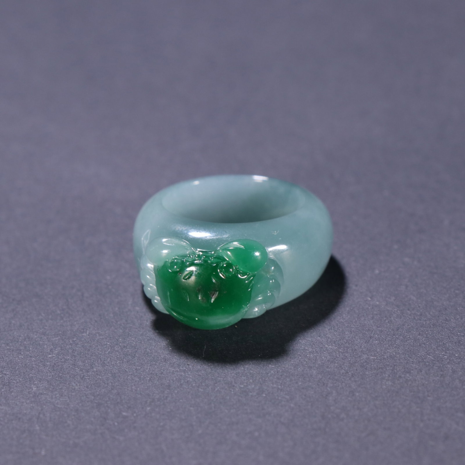 An Exquisite Ingeniously Carved Jadeite Ring For Wealth From All Directions: An Exquisite Ingeniously Carved Jadeite Ring For Wealth From All Directions,China Qing