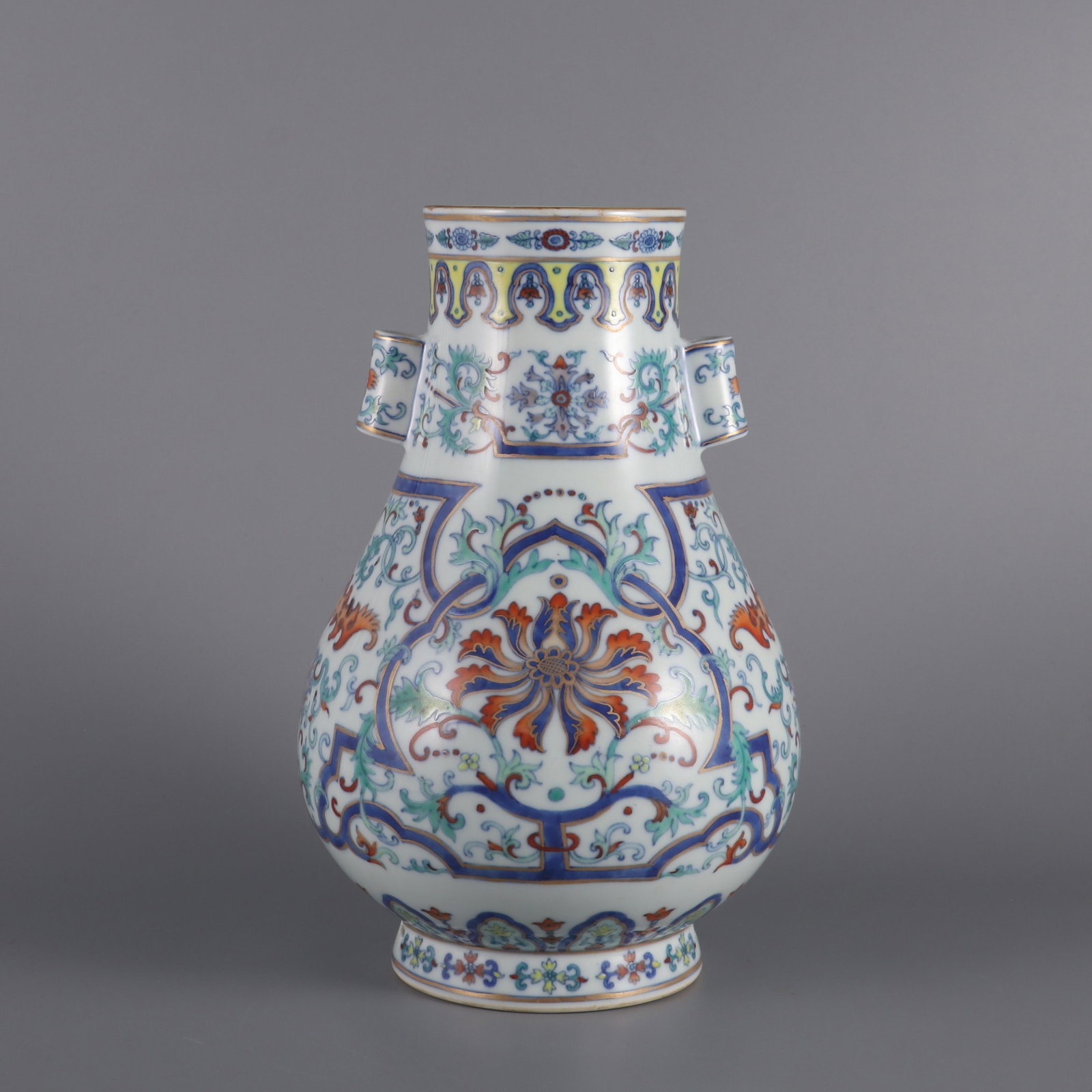 An Exquisite doucai gilded passion flower tube-handle vase, (1 of 9)