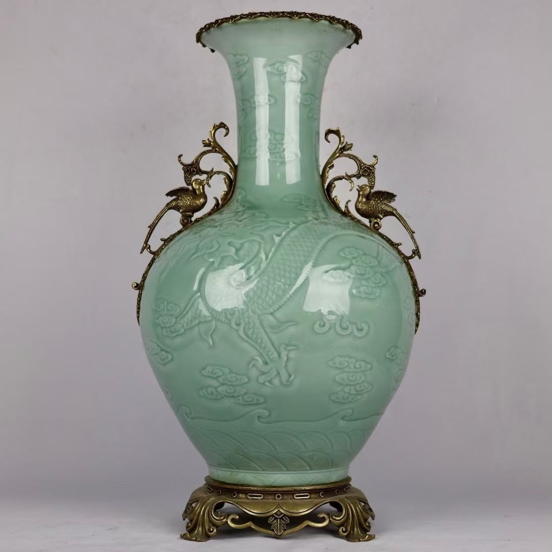 An Exquisite Shadow Celadon Glaze Decorative Vase With Double Copper Flower And Bird Ears,Hidden: An Exquisite Shadow Celadon Glaze Decorative Vase With Double Copper Flower And Bird Ears,Hidden Carved Cloud Dragon Pattern,China Qing Dynasty,Six-Character Qianlong Mark,Dimensions:25.4inx13.8in,