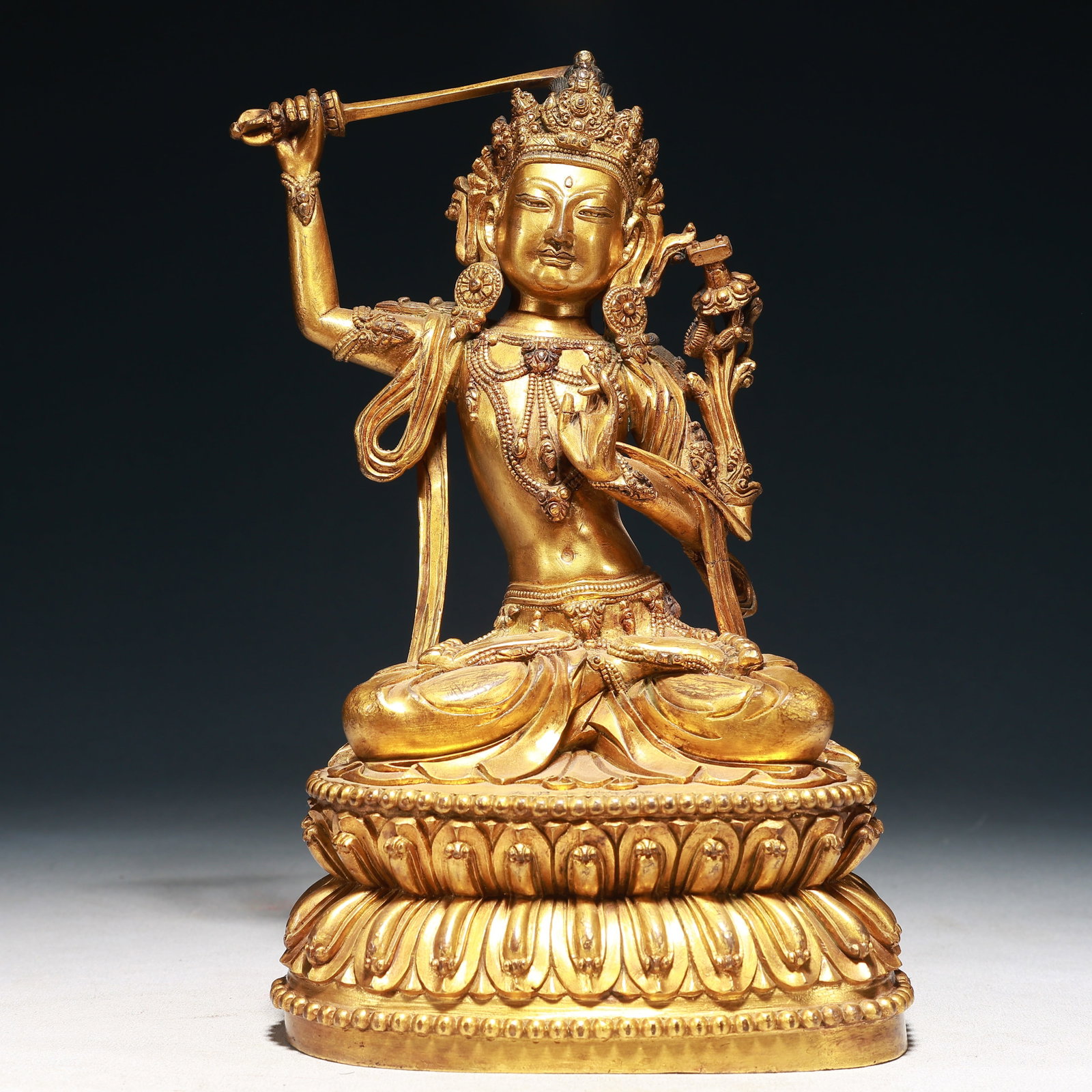 A Solemn Gilt Bronze Statue of Manjusri: A Solemn Gilt Bronze Statue of Manjusri,Ming Dynasty,China,Yongle Six-character Mark,Size:6.3inx4.7inx10.6in,Weight:3650g 铜鎏金文殊菩萨像,中Þ