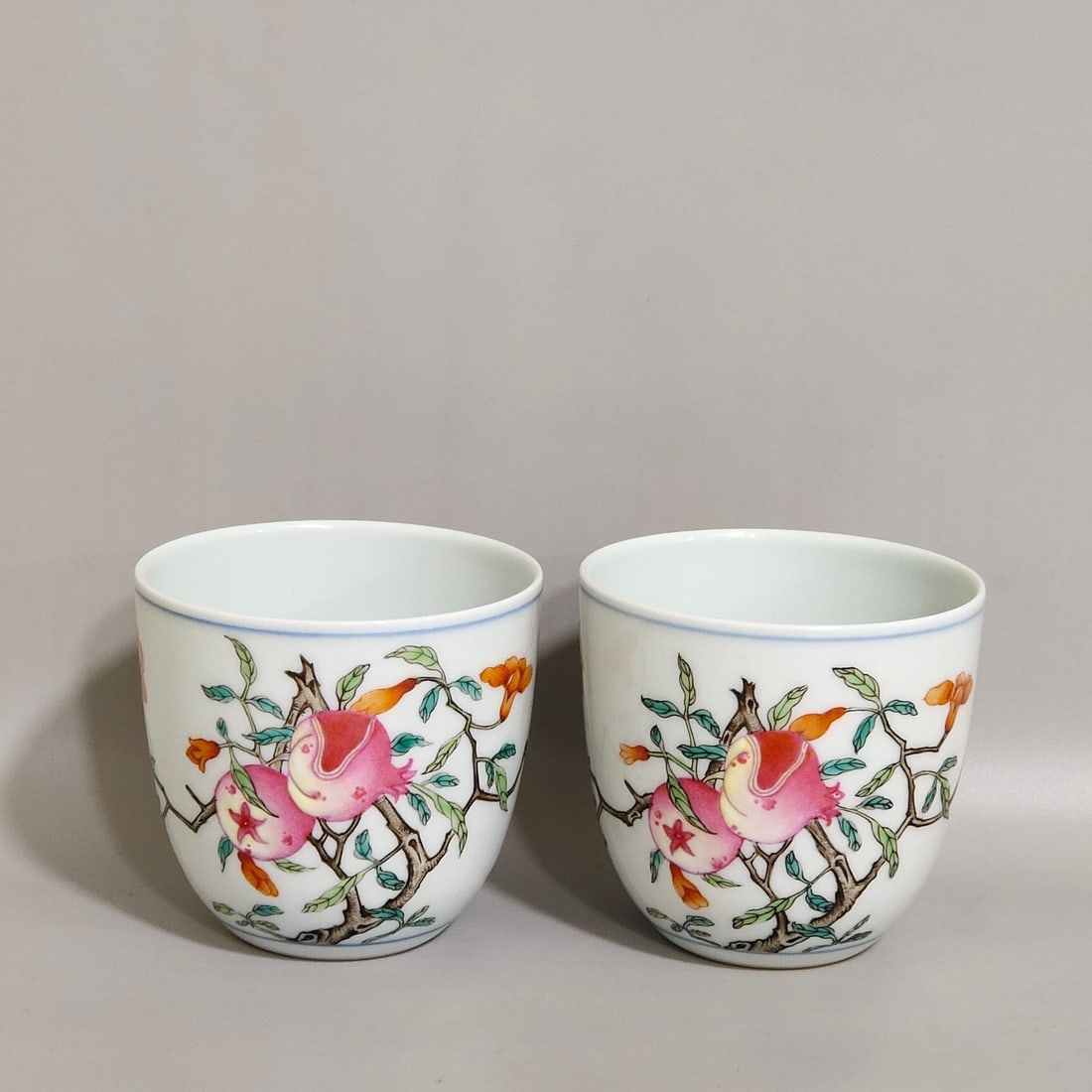 A Pair Of Exquisite Cups Painted With Famille Rose Pomegranate Patterns: A Pair Of Exquisite Cups Painted With Famille Rose Pomegranate Patterns,Qing Dynasty,China,Qianlong Six-character