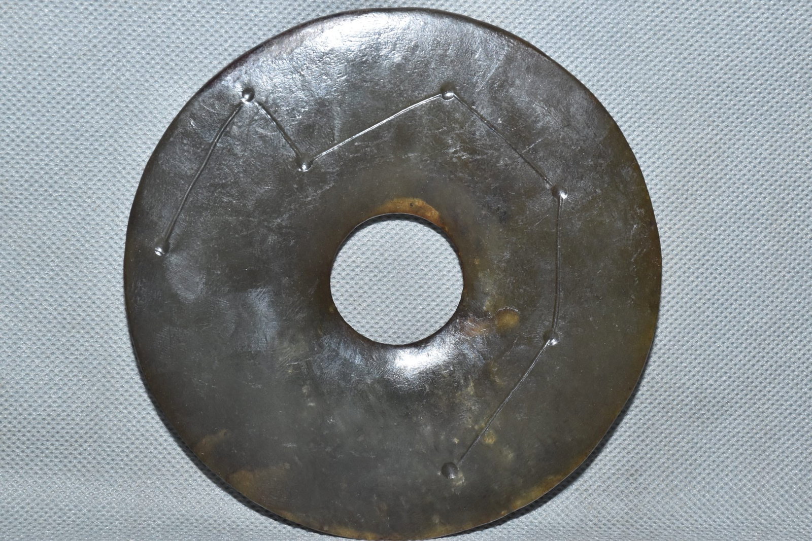 A Fine White Jade Disc Bi Carved With Star Patterns: A Fine White Jade Disc Bi Carved With Star Patterns,Hongshan Culture,Dimensions:4.7in,Weight:210g,白玉刻星纹玉璧,红山文化