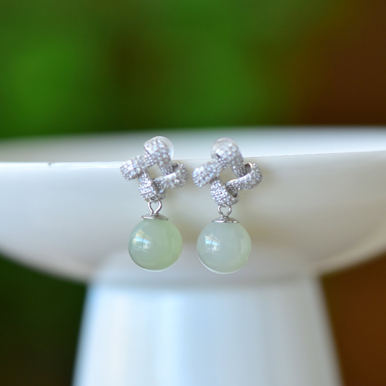 A Pair of Exquisite Sterling Silver Inlaid White Jade Earrings,Inlaid Gems: A Pair of Exquisite Sterling Silver Inlaid White Jade Earrings,Inlaid Gems Size:10mmx10mm 一对纯银镶白玉耳环,嵌宝石