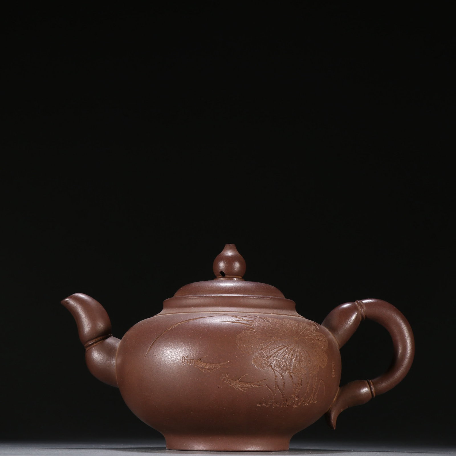 A Fine Chinese Zisha Clay Teapot with Carved Lotus Leaf Decoration: A Fine Chinese Zisha Clay Teapot with Carved Lotus Leaf Decoration,Modern Period,China,Xu Hantang Mark,Size:4.3inx7.3in,紫砂刻荷叶纹茶壶,中国