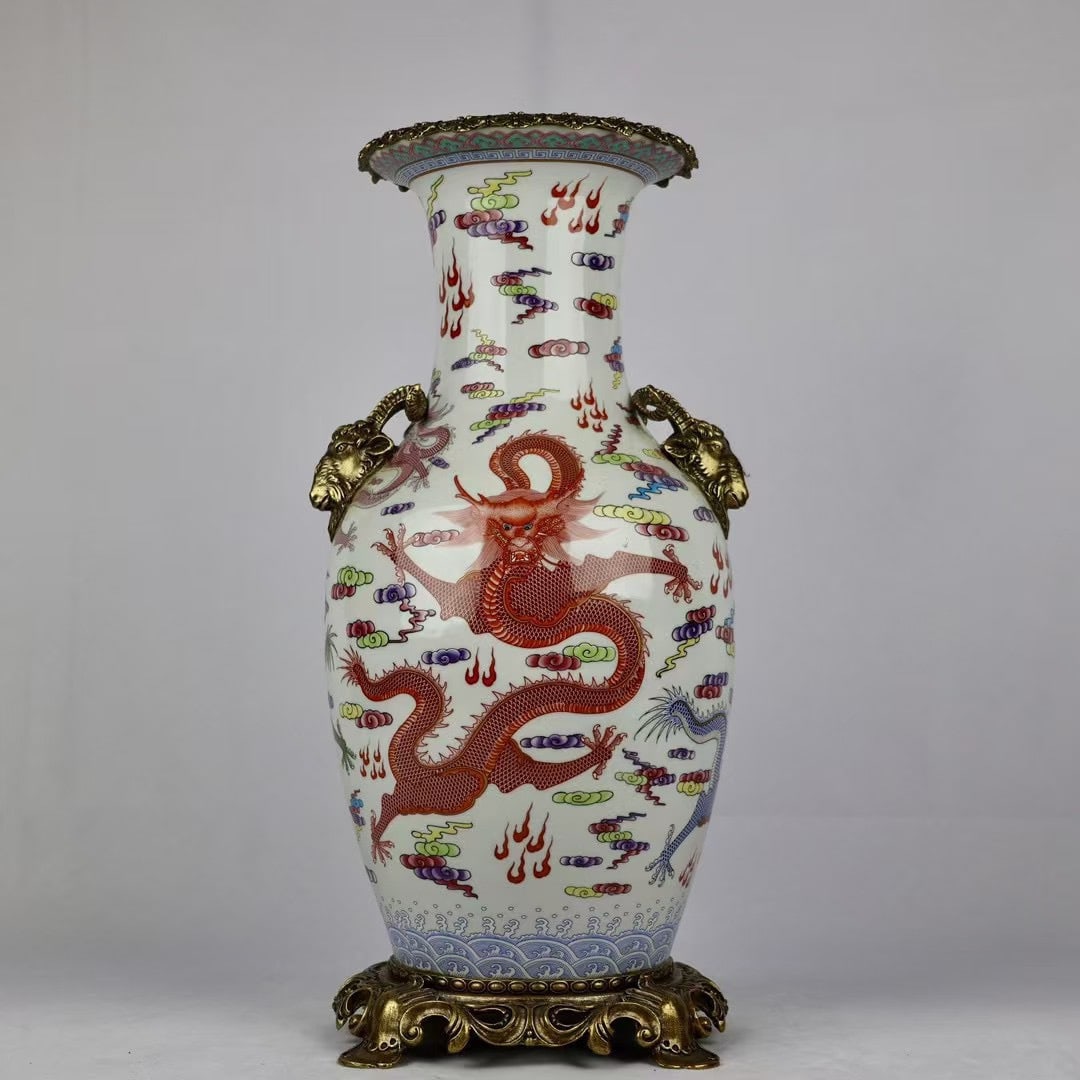 An Exquisite Famille Rose Wide-Mouth Vase With Double Sheep Head Ears And Copper Mounts,Cloud Dragon: An Exquisite Famille Rose Wide-Mouth Vase With Double Sheep Head Ears And Copper Mounts,Cloud Dragon Birthday Celebration Pattern,China Qing Dynasty,Six-Character Qianlong Mark,Dimensions:18.5inx9.1in