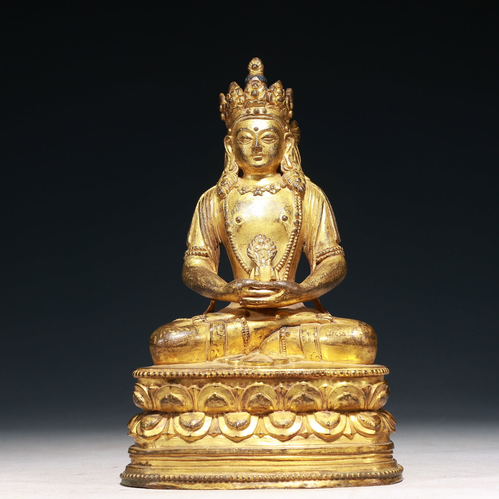A Solemn Gilt Bronze Statue of Amitayus: A Solemn Gilt Bronze Statue of Amitayus,Qing Dynasty,China,Size:5.9inx4.3inx9.4in,Weight:2950g 铜鎏金无量寿佛像,中国清代