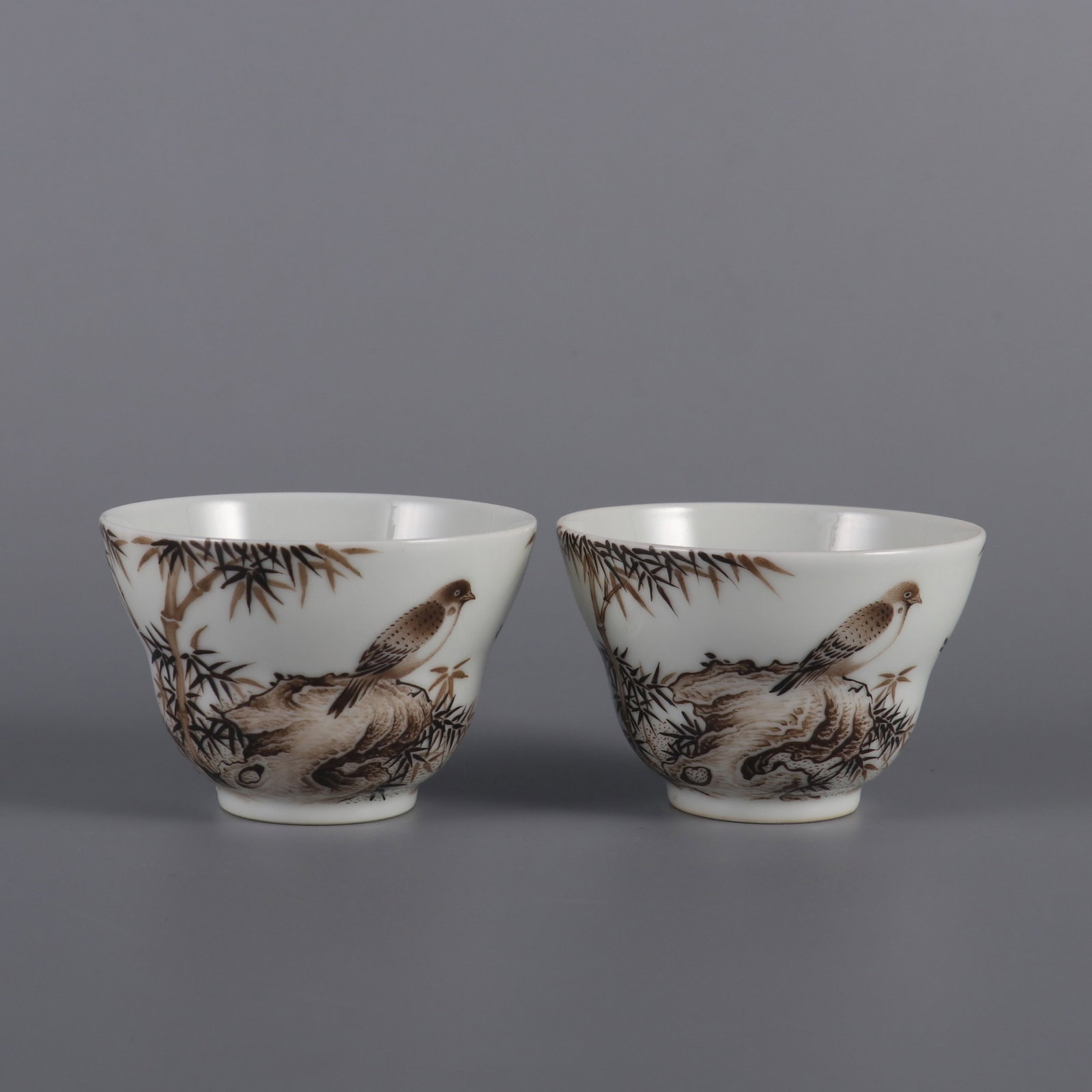 A Pair of Exquisite ink color bamboo and sparrow waisted cups,: A Pair of Exquisite ink color bamboo and sparrow waisted cups,Qing Dynasty, China,Yongzheng Four-character Mark,Size:1.8inx2.6in,一对墨彩竹雀图折腰