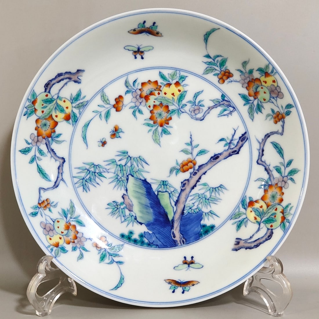 An Exquisite Ornamental Plate With Doucai Bamboo,Rock,Melon,Fruit And Butterfly Patterns: An Exquisite Ornamental Plate With Doucai Bamboo,Rock,Melon,Fruit And Butterfly Patterns,Qing Dynasty,China,Kangxi Six-character Mark,斗彩竹石瓜果蝶纹&#