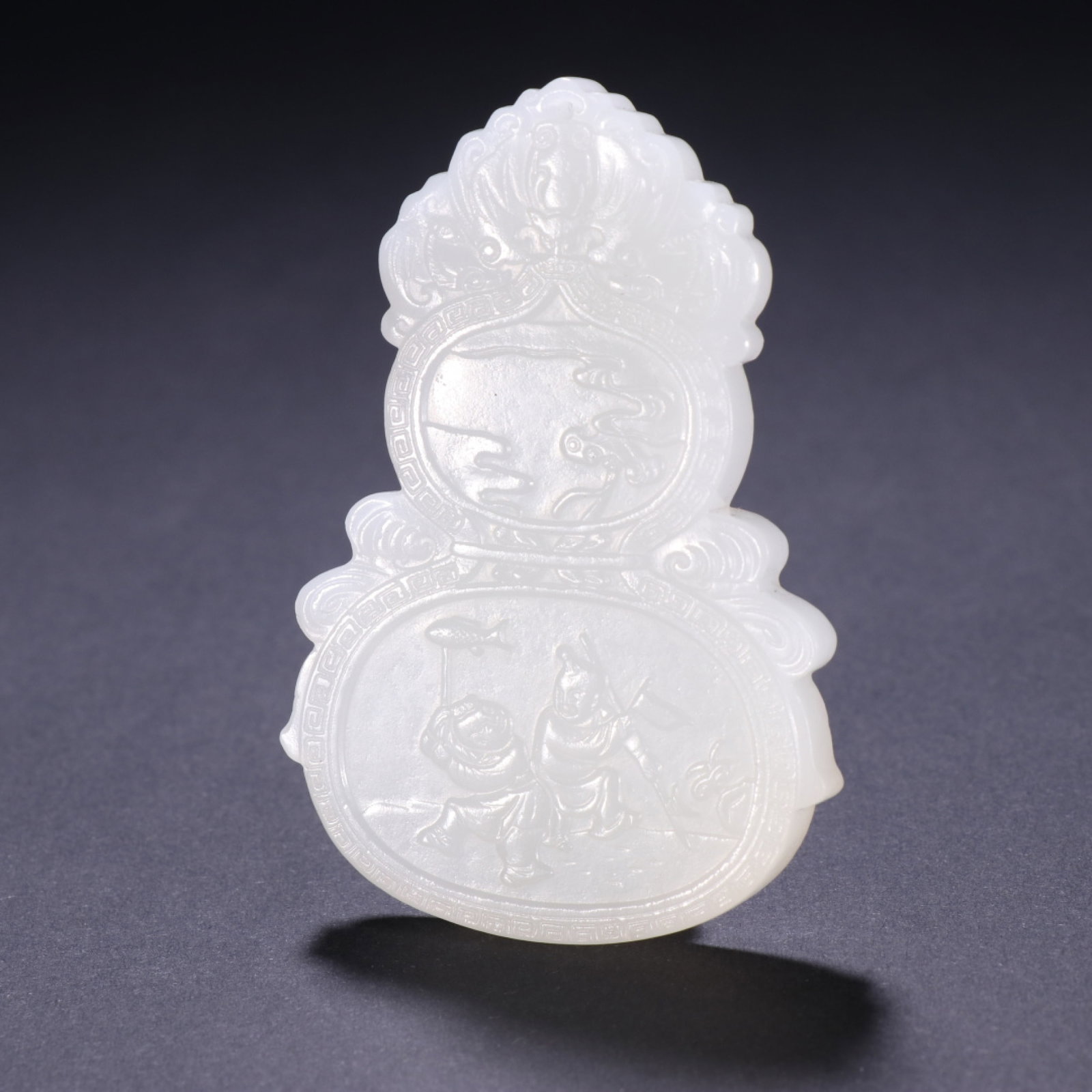 An Exquisite White Jade Gourd-Shaped Pendant With Figure Pattern (1 of 9)