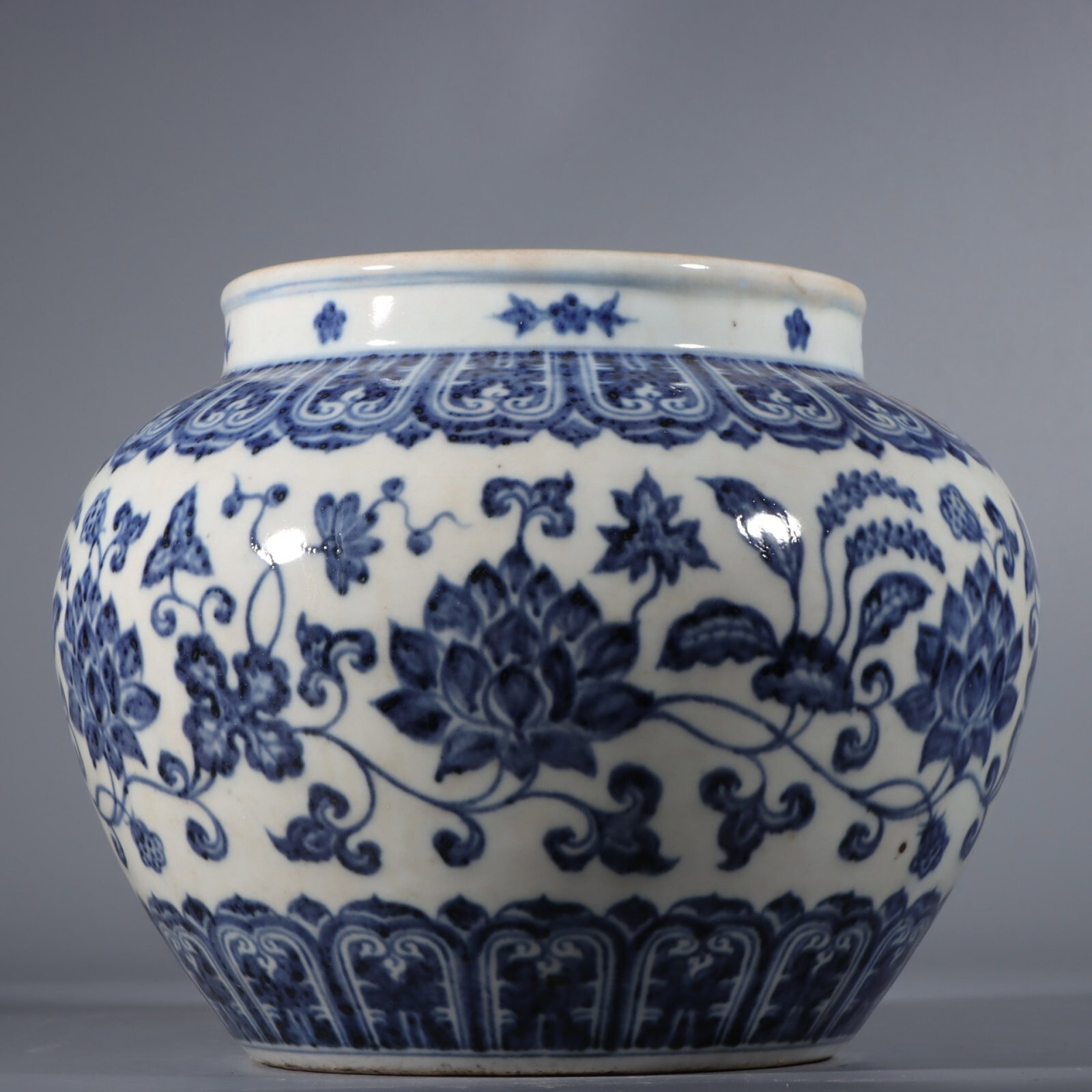 A Fine Underglaze Blue Jar With Floral Scrolls: A Fine Underglaze Blue Jar With Floral Scrolls,Ming Dynasty,China,Size:7.5inx9.4in,青花花卉罐中国明代,